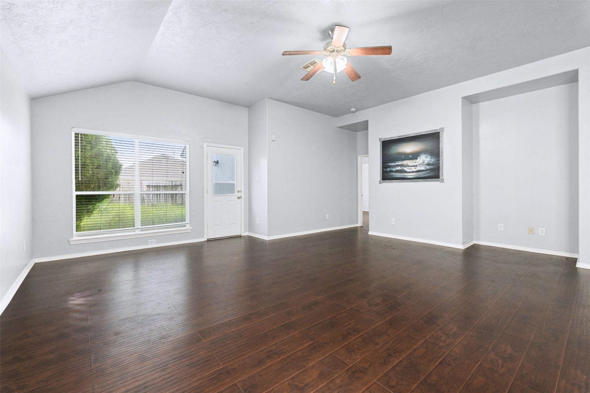 Bright and spacious living room that flows seamlessly into the dining area and kitchen.