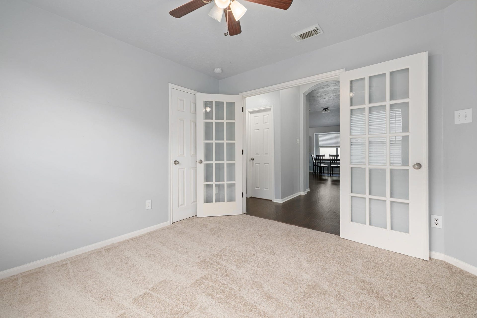 Private home office with glass French doors, perfect for working from home.