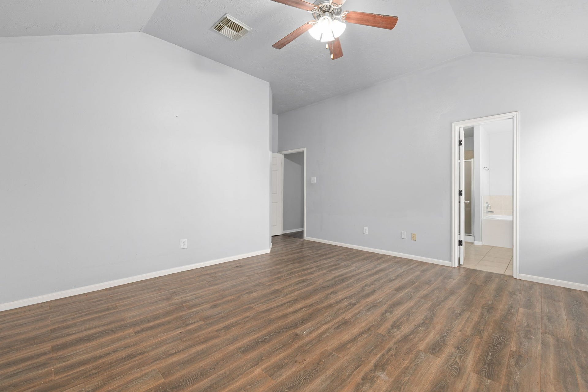 Peaceful primary suite offering a spacious layout and abundant natural light
