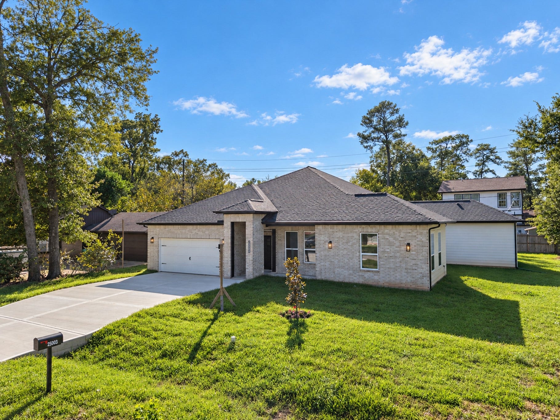 25903 Woodglen Drive, Spring, TX 77386 Front Exterior & Spacious Driveway