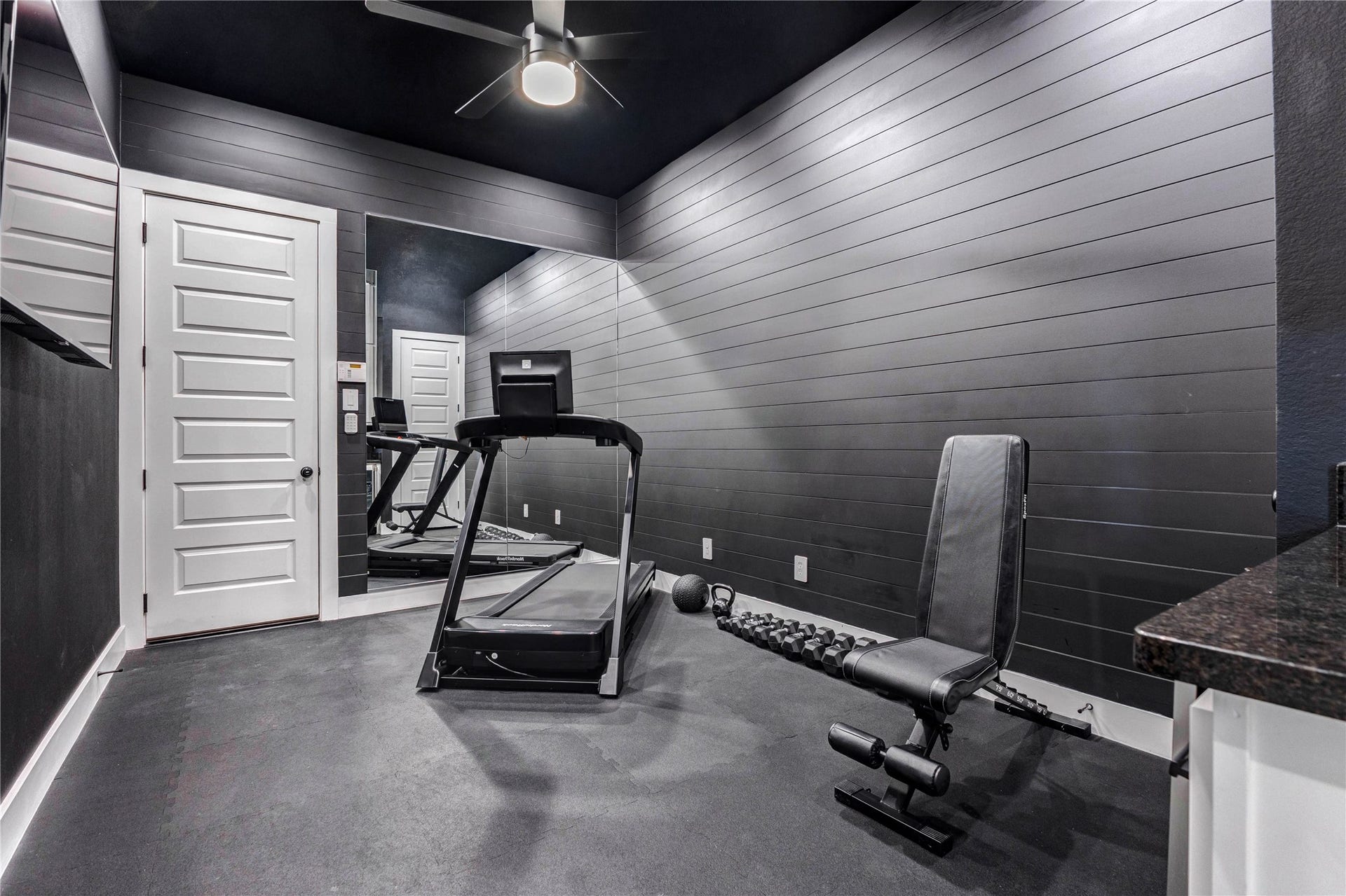 4510 Windmill Landing Lane, Fulshear, TX 77441 Bonus Room that is used as Gym but has endless possibilities. Built in cabinet with refrigerator for beverages.