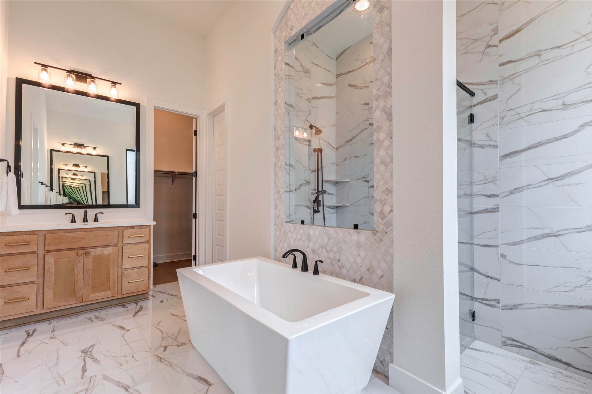 4510 Windmill Landing Lane, Fulshear, TX 77441 The shower area is exceptionally roomy, offering ample space for a comfortable and relaxing bathing experience.