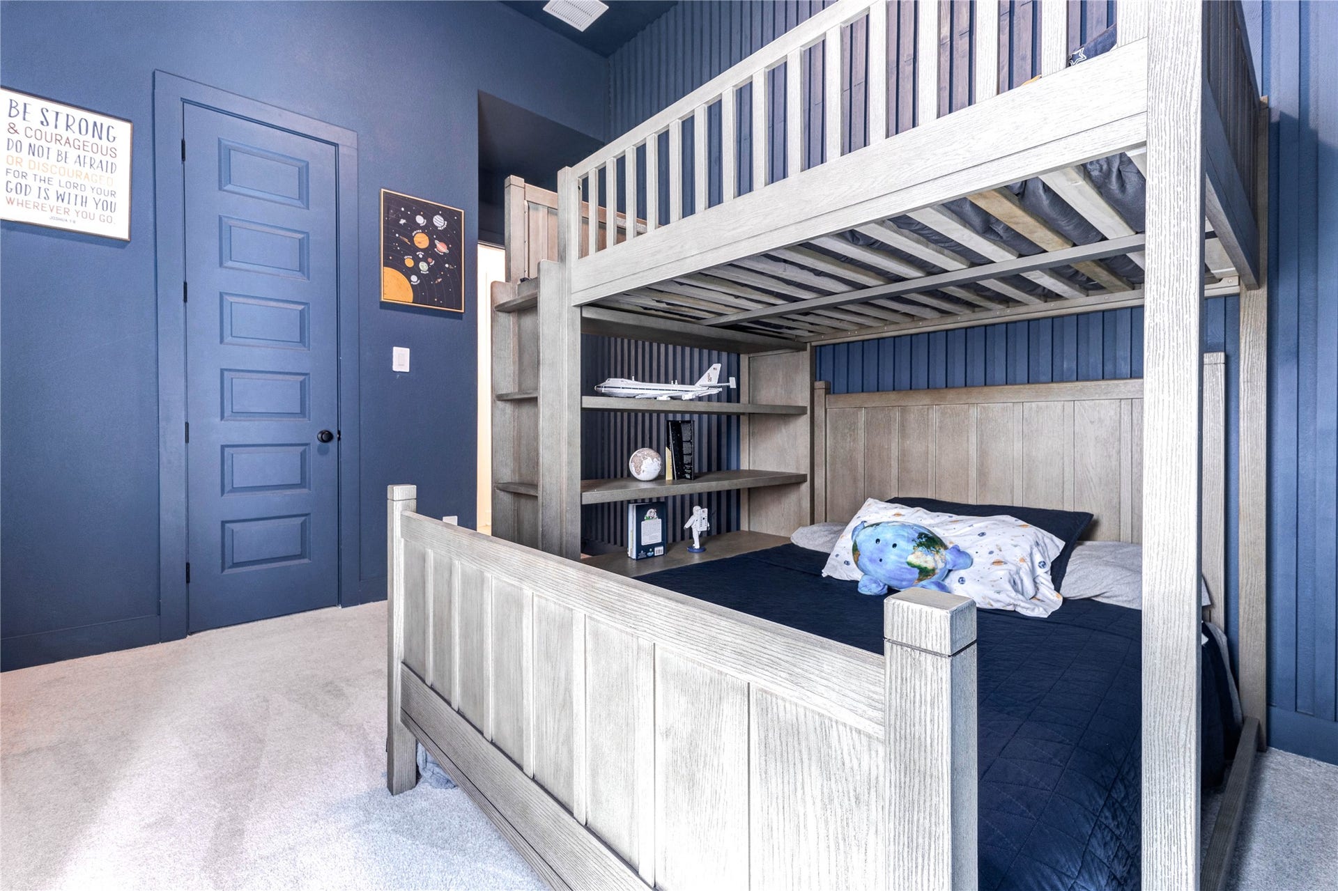 4510 Windmill Landing Lane, Fulshear, TX 77441 This cozy children's bedroom features a blue wall