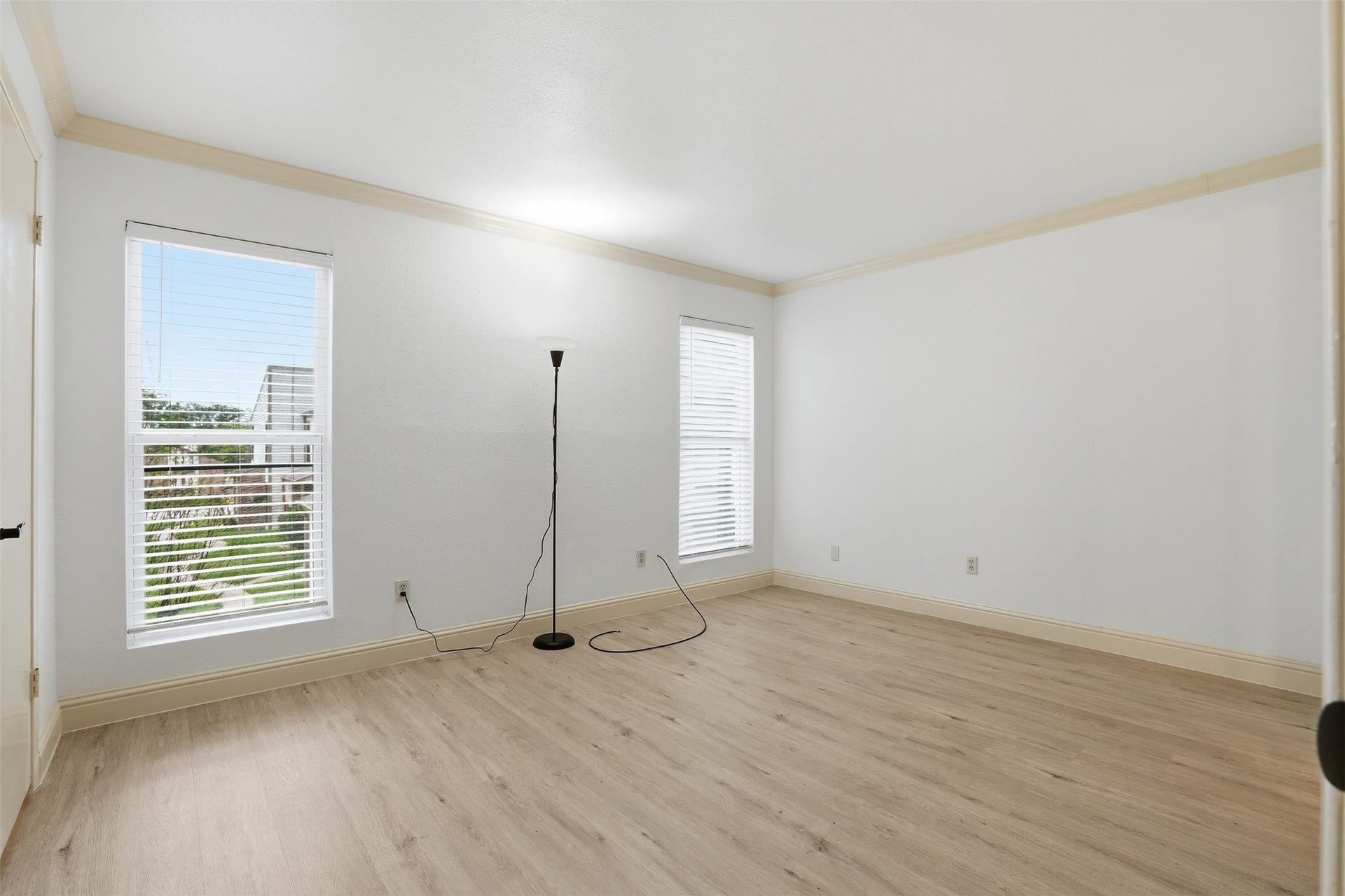 Second primary or guest room, featuring beautiful crown molding and plenty of natural light!