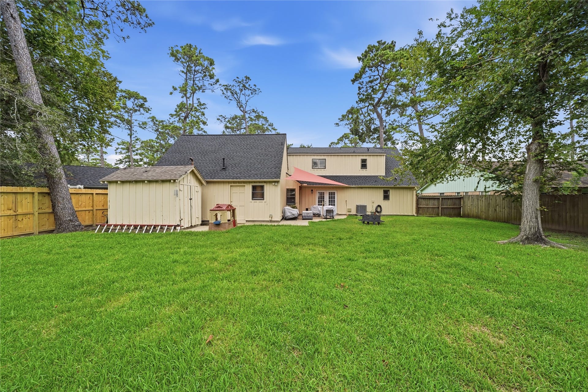 3037 Longwood Lane, Dickinson, TX 77539 Massive backyard with a porch