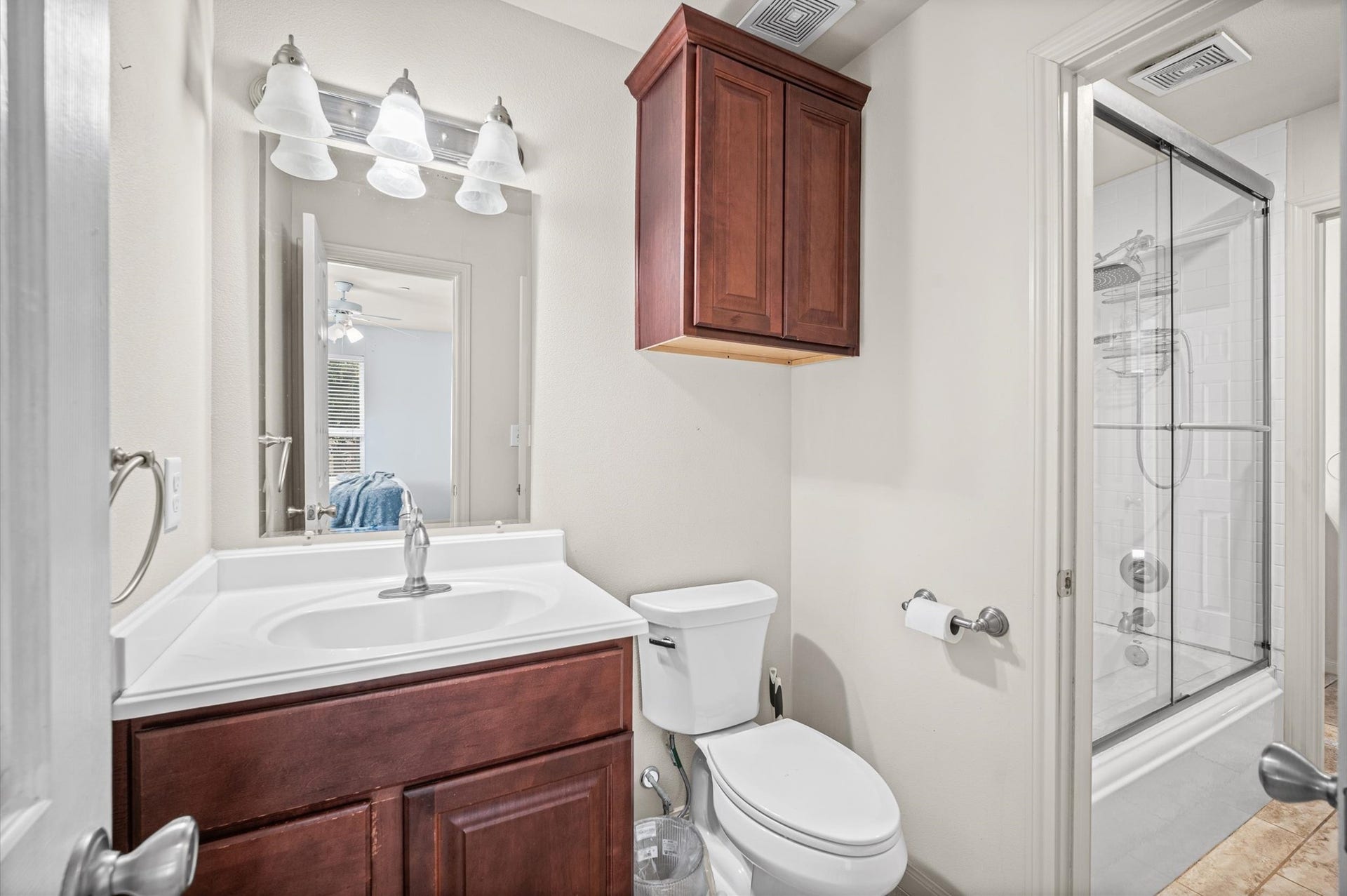 7600 Emmett F Lowry Expressway, #416, Texas City, TX 77591 Elegant bathroom featuring a modern vanity with ample cabinet space, sleek lighting, and a glass-enclosed shower for a touch of luxury.