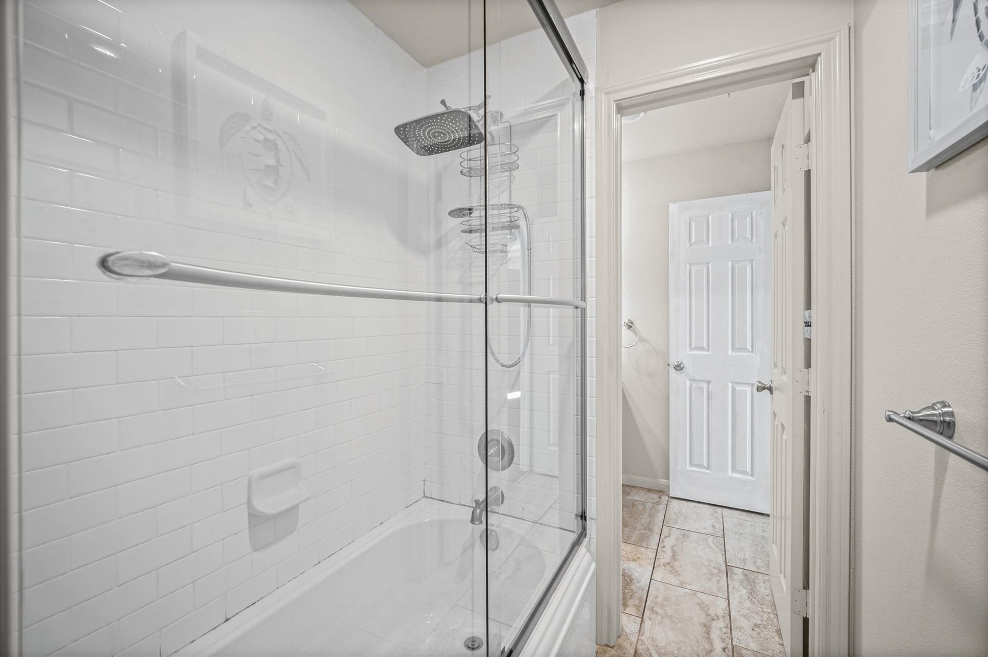 7600 Emmett F Lowry Expressway, #416, Texas City, TX 77591 Spacious bathroom featuring a modern glass-enclosed shower with sleek fixtures and elegant tile flooring.
