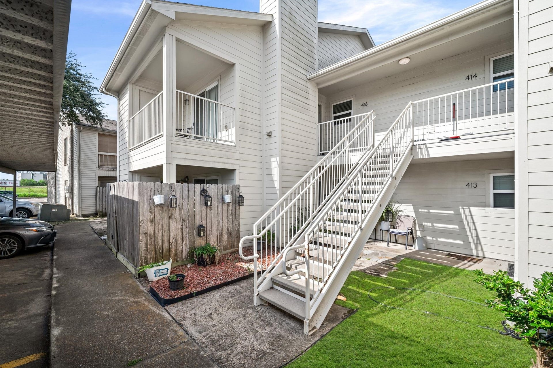 7600 Emmett F Lowry Expressway, #416, Texas City, TX 77591 Bright and inviting second-floor unit with a charming balcony, perfect for enjoying relaxed outdoor moments.