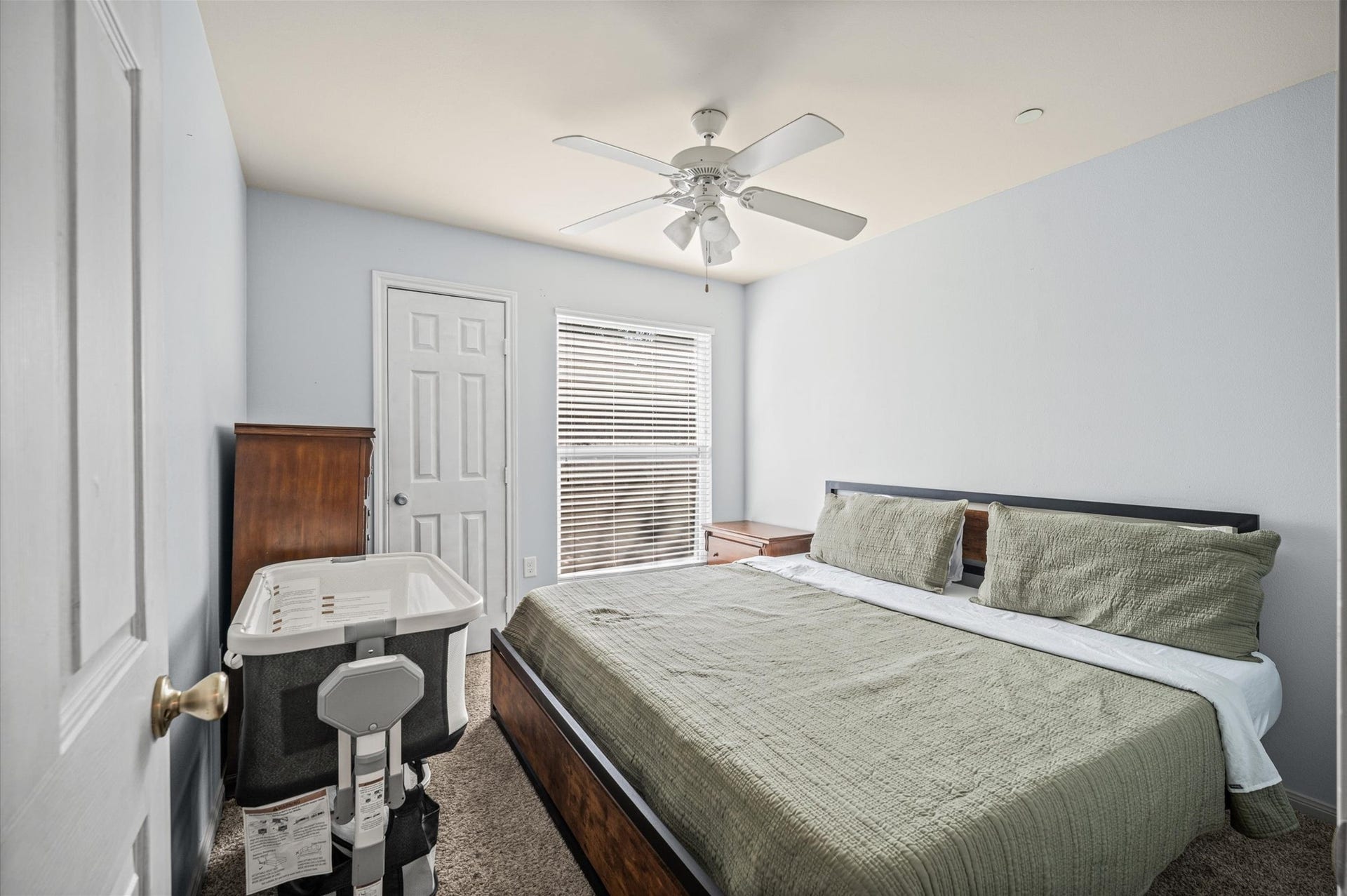 7600 Emmett F Lowry Expressway, #416, Texas City, TX 77591 Cozy bedroom, soft carpeting, and ample natural light from large windows.
