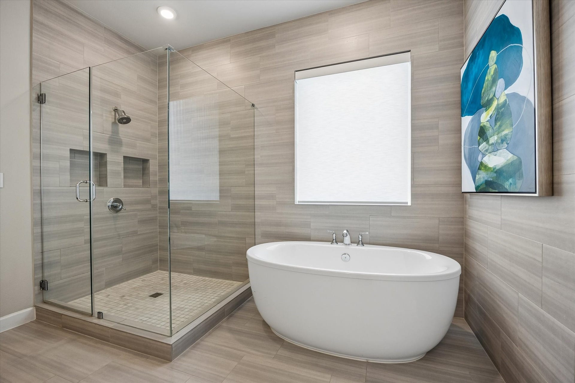 Whether youre enjoying the seamless glass shower or the deep soaking tub, this luxurious bathroom offers total relaxation with the added convenience of a private water closet and linen closet. Electric Hunter Douglas shades provide extra privacy.