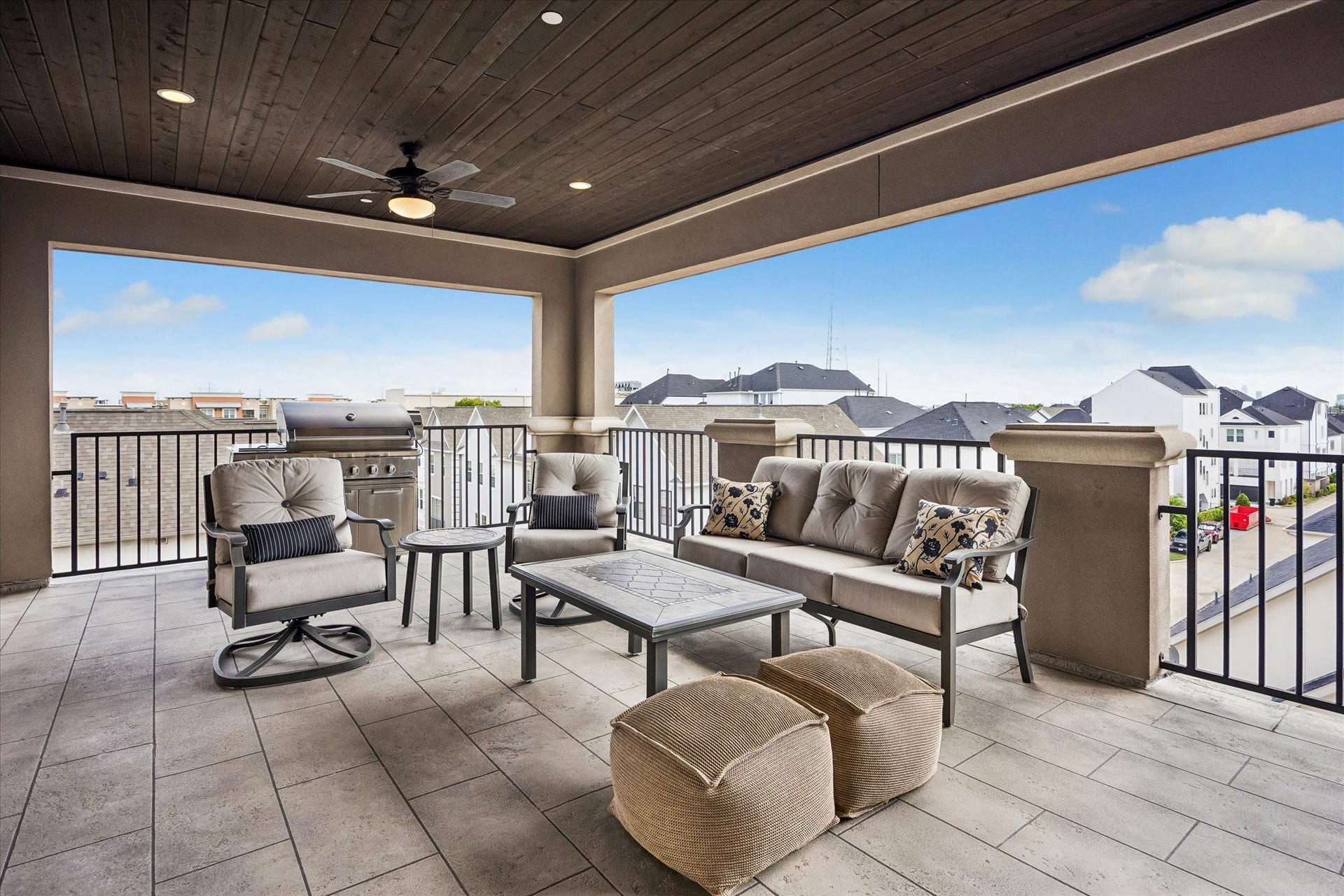Appreciate the elegant wood-slatted ceilings, accented by recessed lighting and dual ceiling fans. The expansive patio provides a versatile footprint for various furniture arrangements and a dedicated space for grilling, making it a true extension of the home.