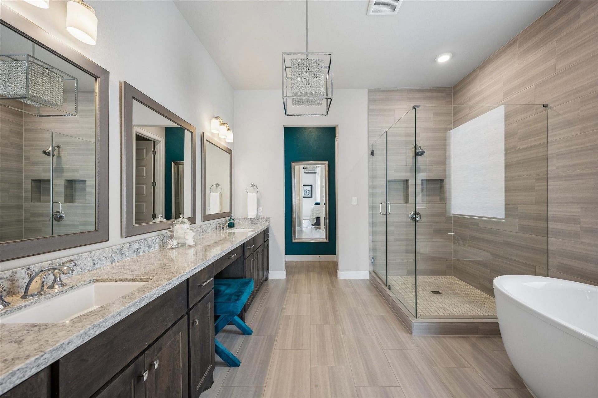 Start your day in a spa-inspired bath featuring granite countertops, double sinks, and dedicated vanity.