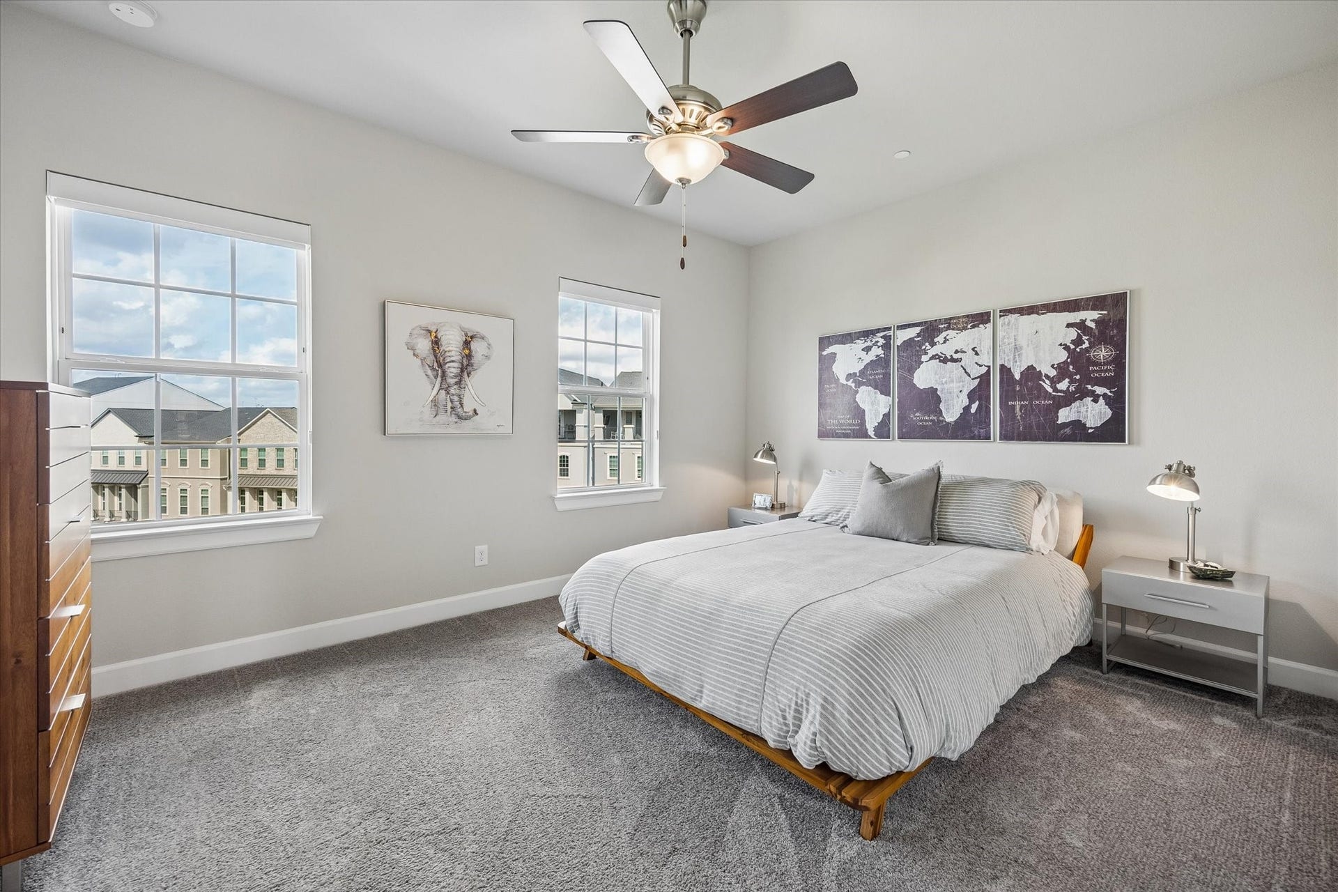 Located on the fourth floor, this guest bedroom is a comfortable escape complete with ceiling fan, premium Hunter Douglas window shades, walk-in closet, and ensuite bathroom.