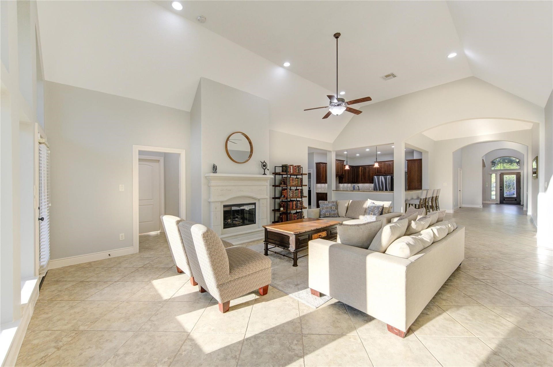 2914 Legend Hill Drive, Katy, TX 77494 Living area with next-gen suite to the left of the fireplace