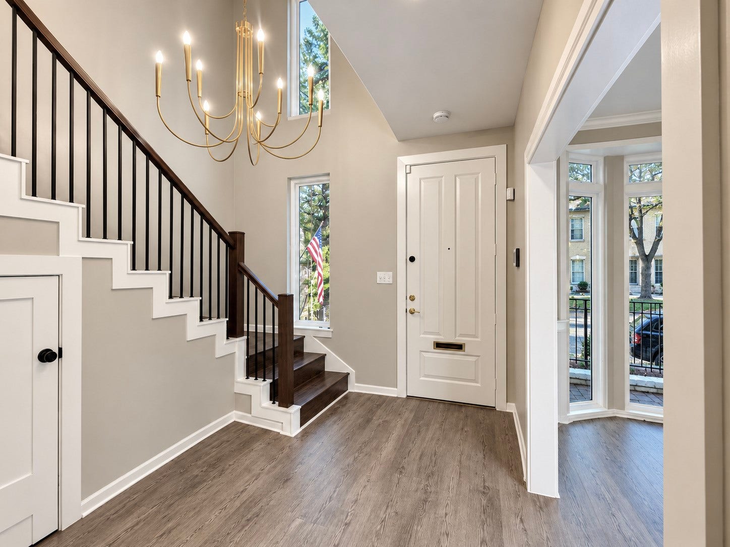 The foyer leads to the living room and also a study/den off the front of the townhouse.