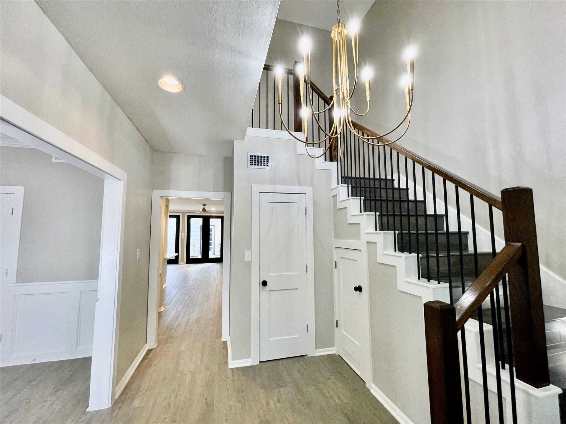 Enter into the two story foyer with updated lighting and fresh paint.