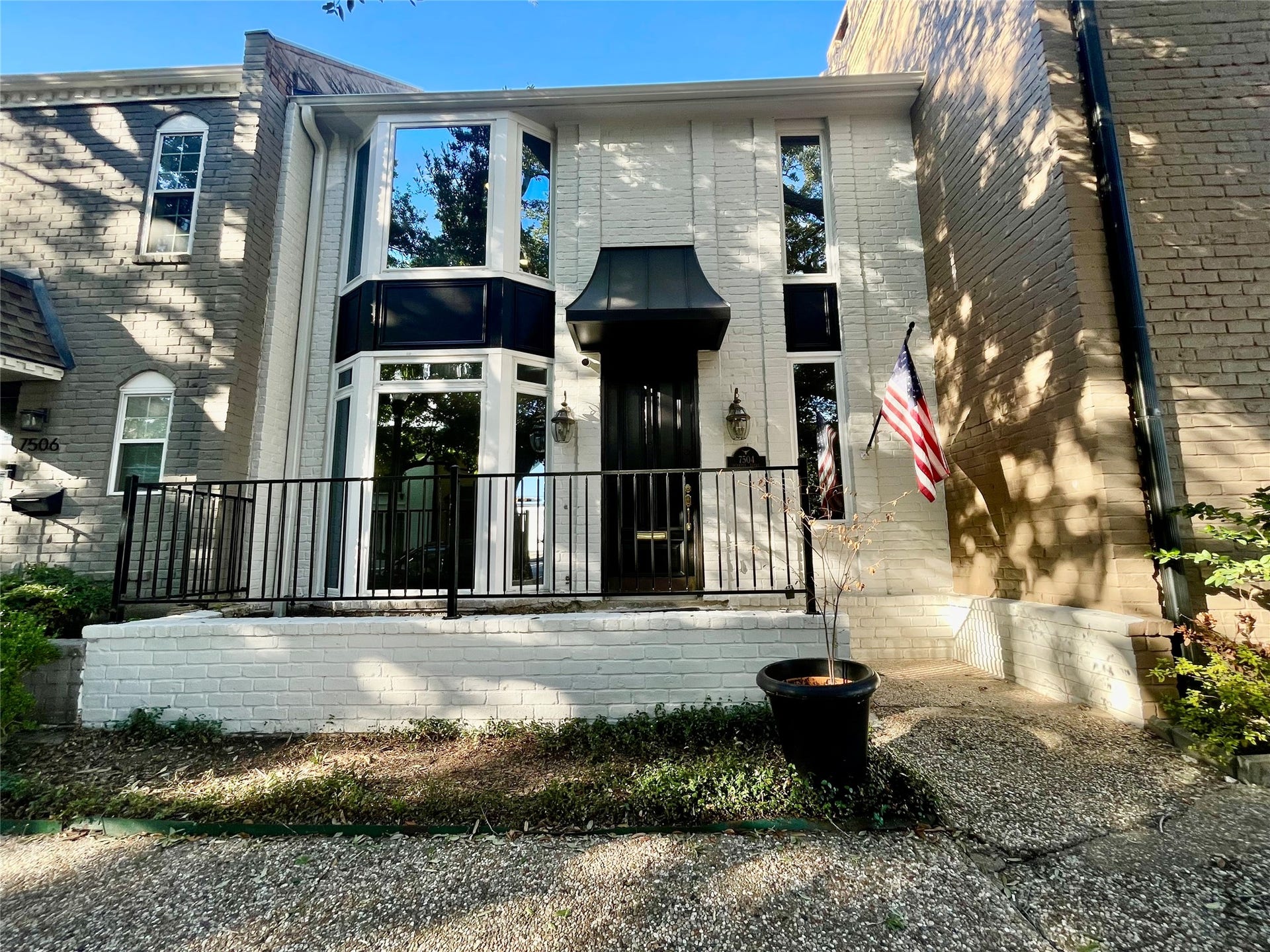 Welcome to 7504 Olympia. Come in an enjoy townhome living and enjoy the shade provided by the oak trees.