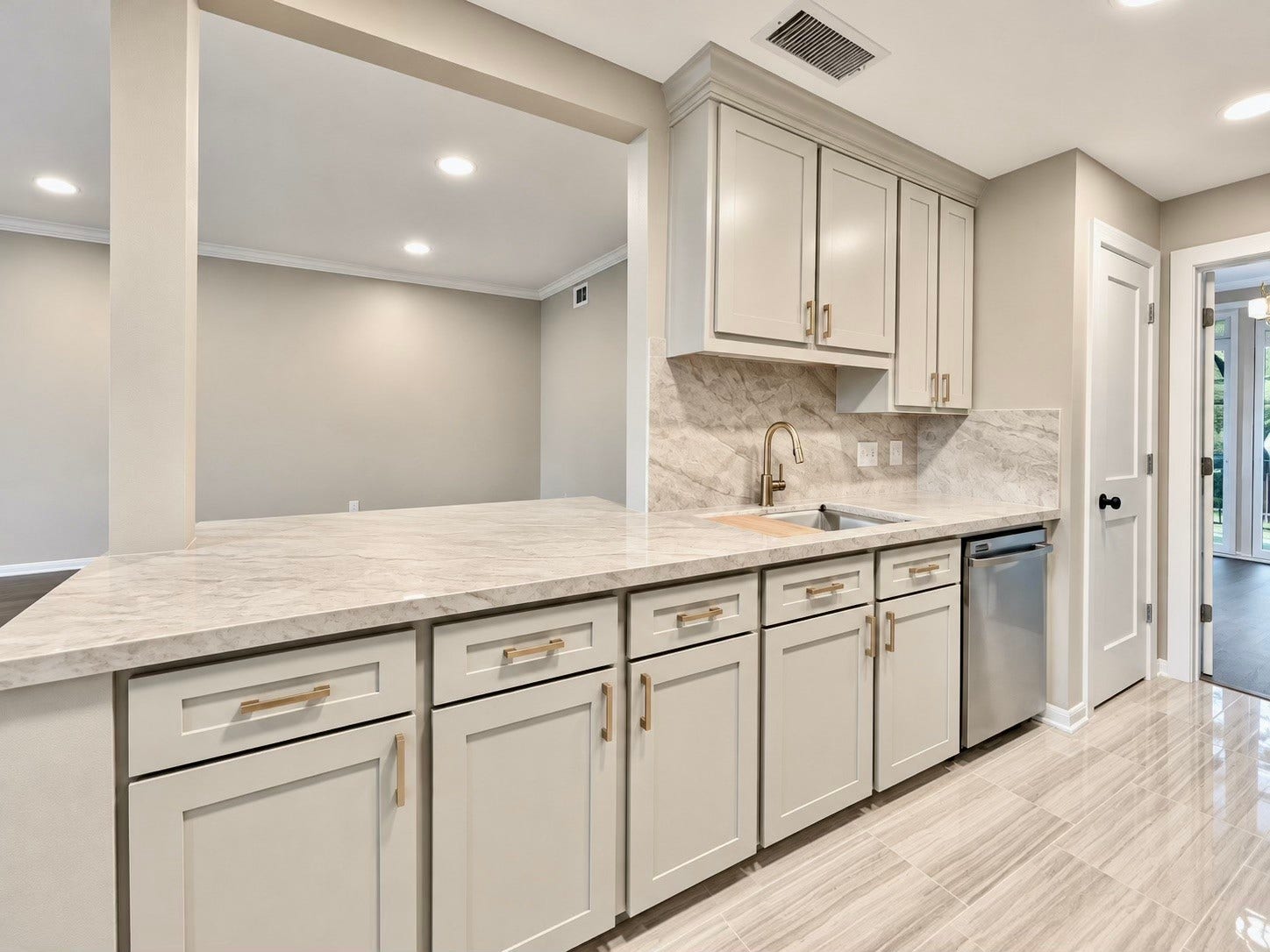 By opening the wall between the kitchen and the living room a great area for entertaining was created.