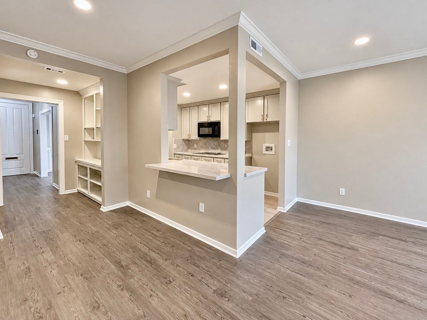 Taking a peak into the kitchen from the living room. You can see the coffee bar possibilities.