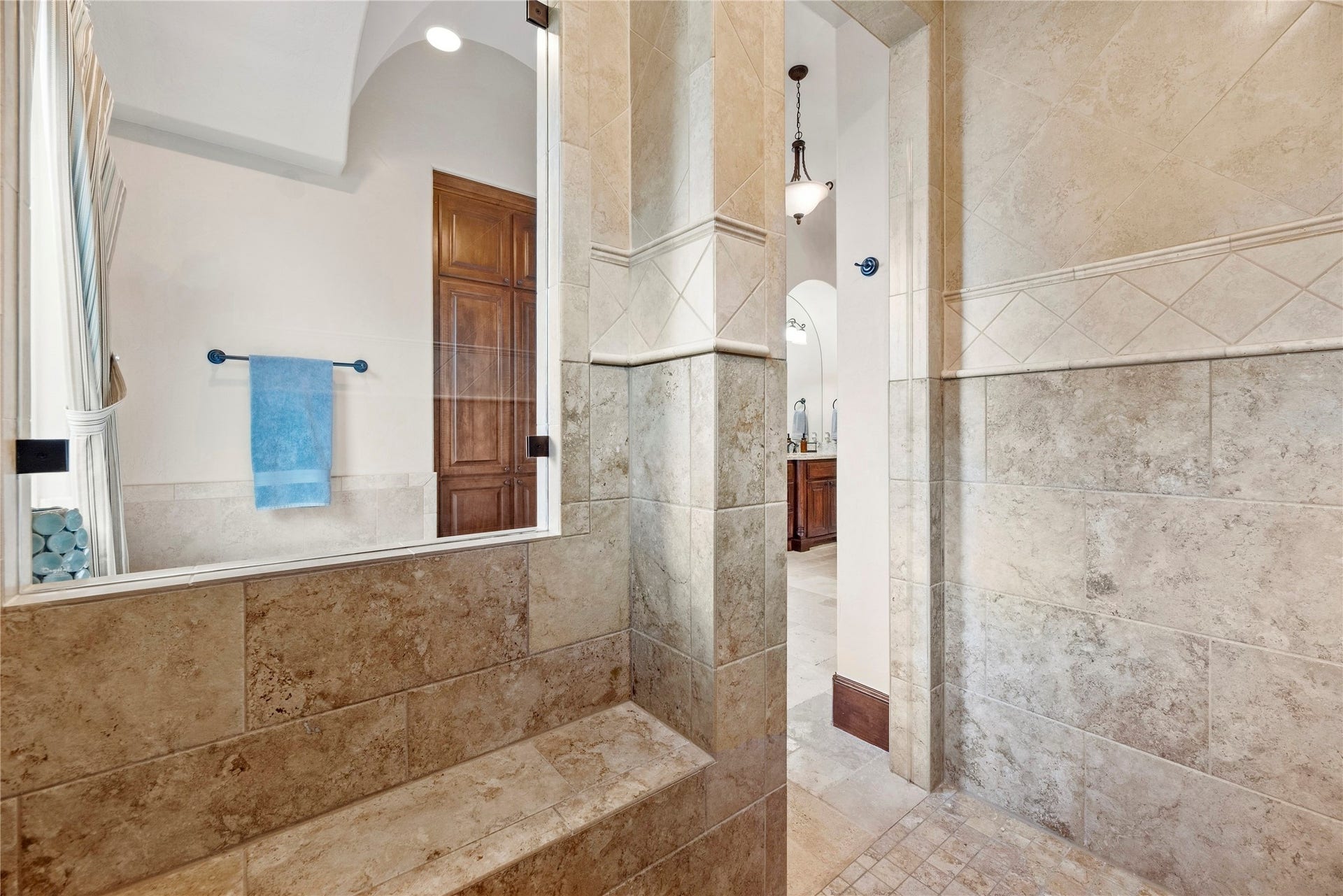 10114 E Frio River Circle N, Cypress, TX 77433 Shower is tucked in the corner with a bench and a view of that awesome bathroom