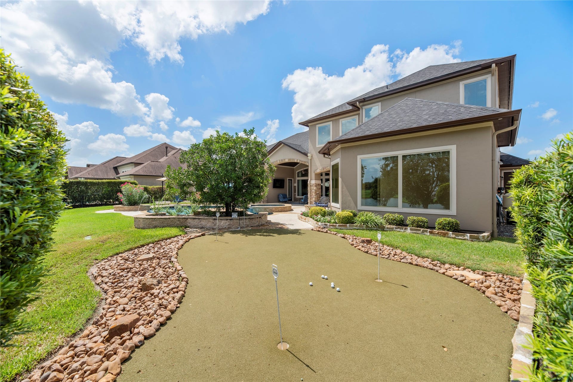 10114 E Frio River Circle N, Cypress, TX 77433 Built in putting green, is fun for all ages