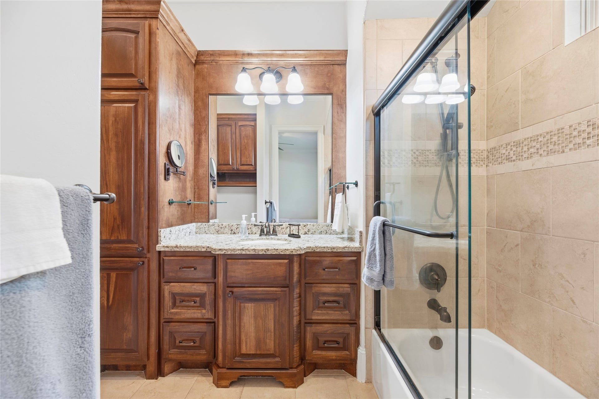 10114 E Frio River Circle N, Cypress, TX 77433 In-suite bath for bedroom 2 with sliding glass doors for the tub & shower