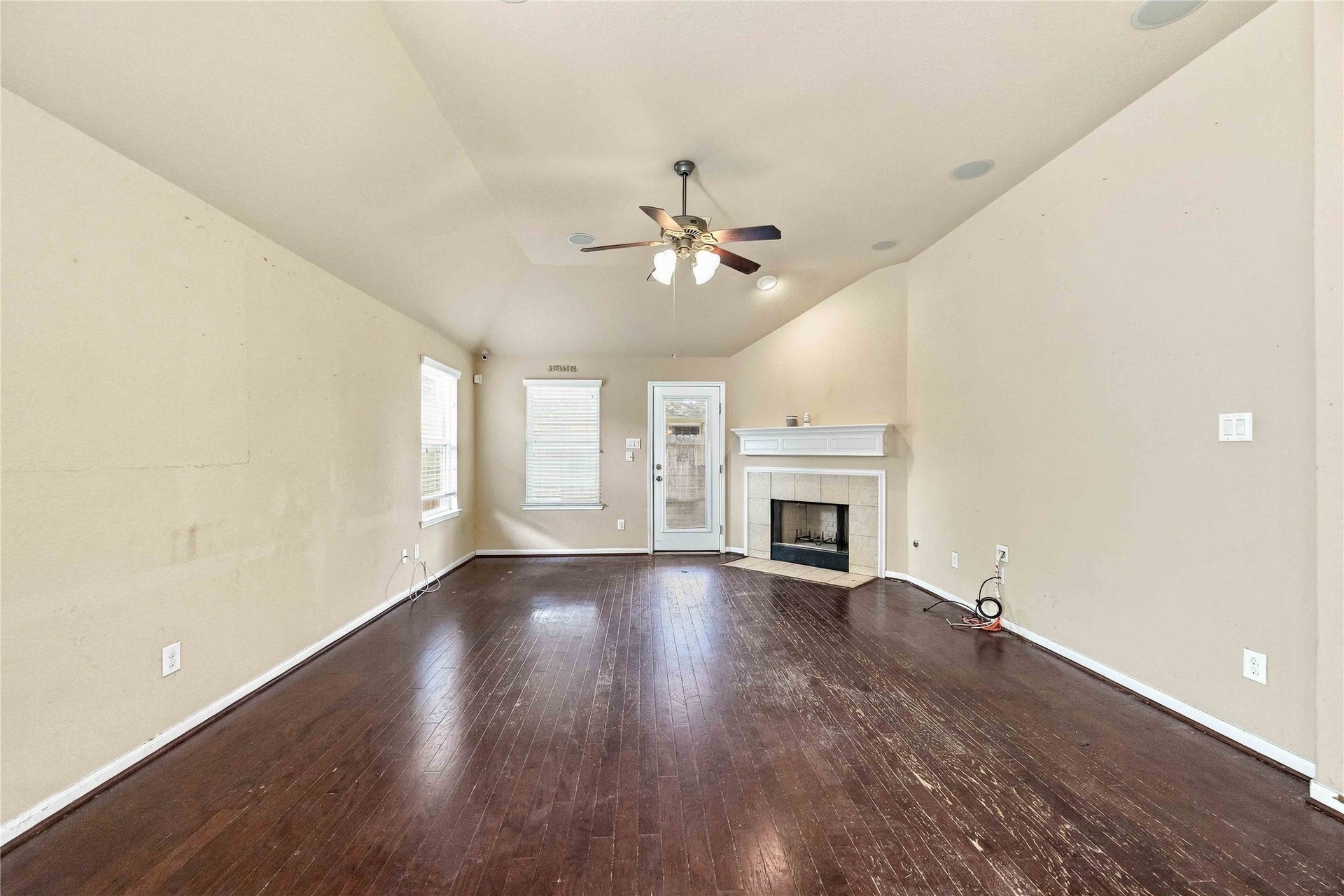 Generously sized living room with direct access to the backyard.