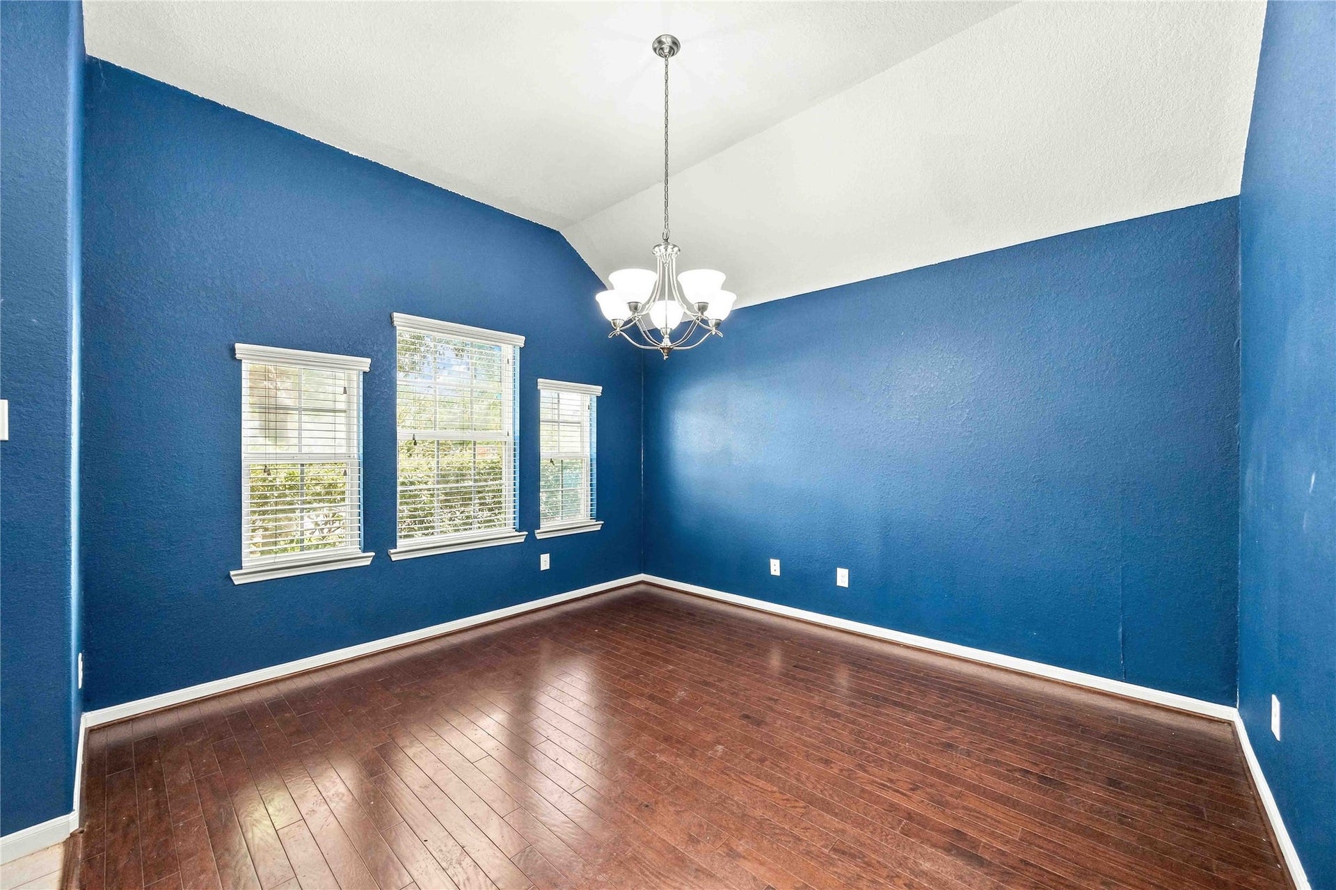 Formal dining room offers plenty of natural light.