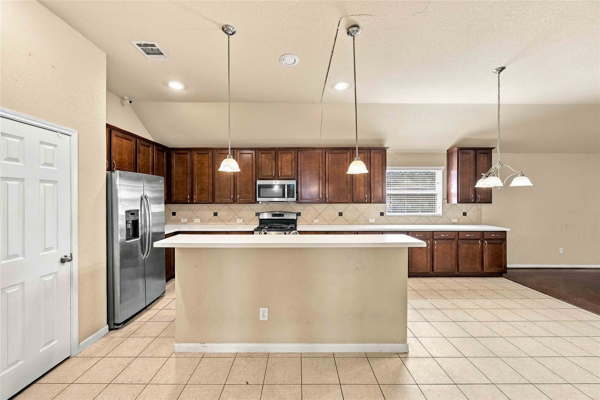 Open kitchen layout with breakfast bar.