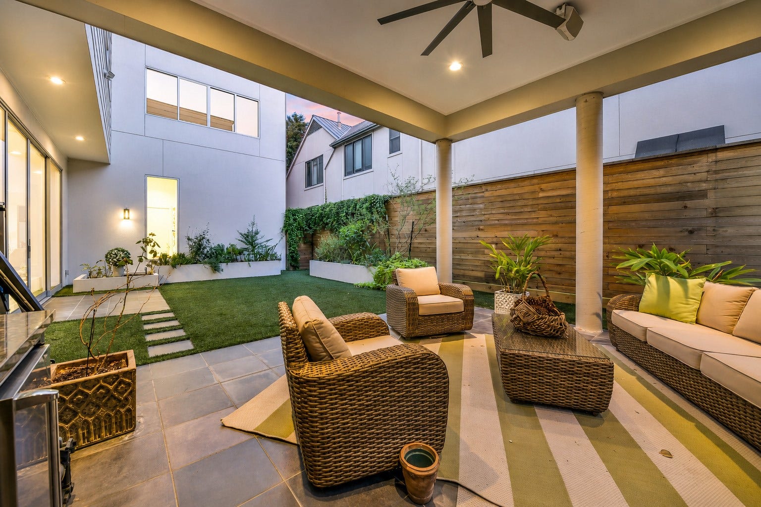 2302 Persa Street, Houston, TX 77019 The private outdoor retreat pairs comfort and sophistication, highlighted by an oversized covered patio with recessed lighting, outdoor kitchen and ceiling fan. The spaces creates an inviting setting for seemless indoor and outdoor living.