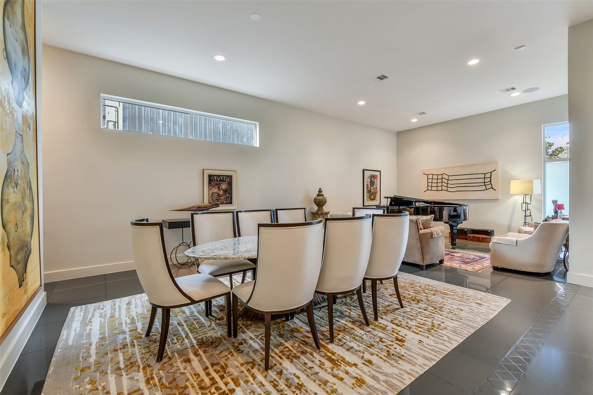 2302 Persa Street, Houston, TX 77019 Gorgeous formal dining with high-set window to establish a sophisticated, uncluttered backdrop for fine dining and formal entertaining.
