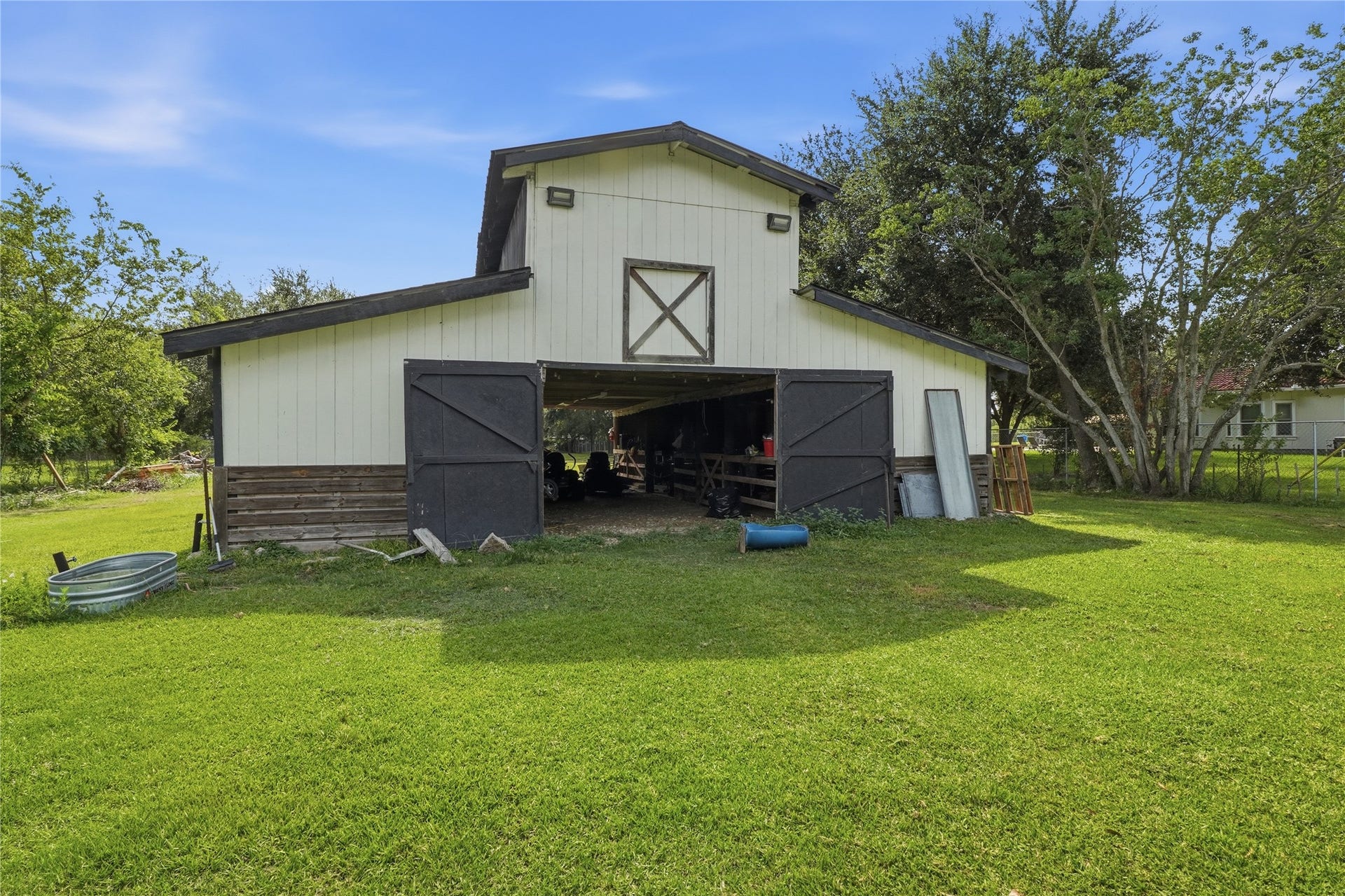 3305 Luella Avenue, Deer Park, TX 77536 Impressive barn-style outbuilding offers exceptional versatility for work, storage, hobbies, or equestrian use, featuring approximately six horse stalls