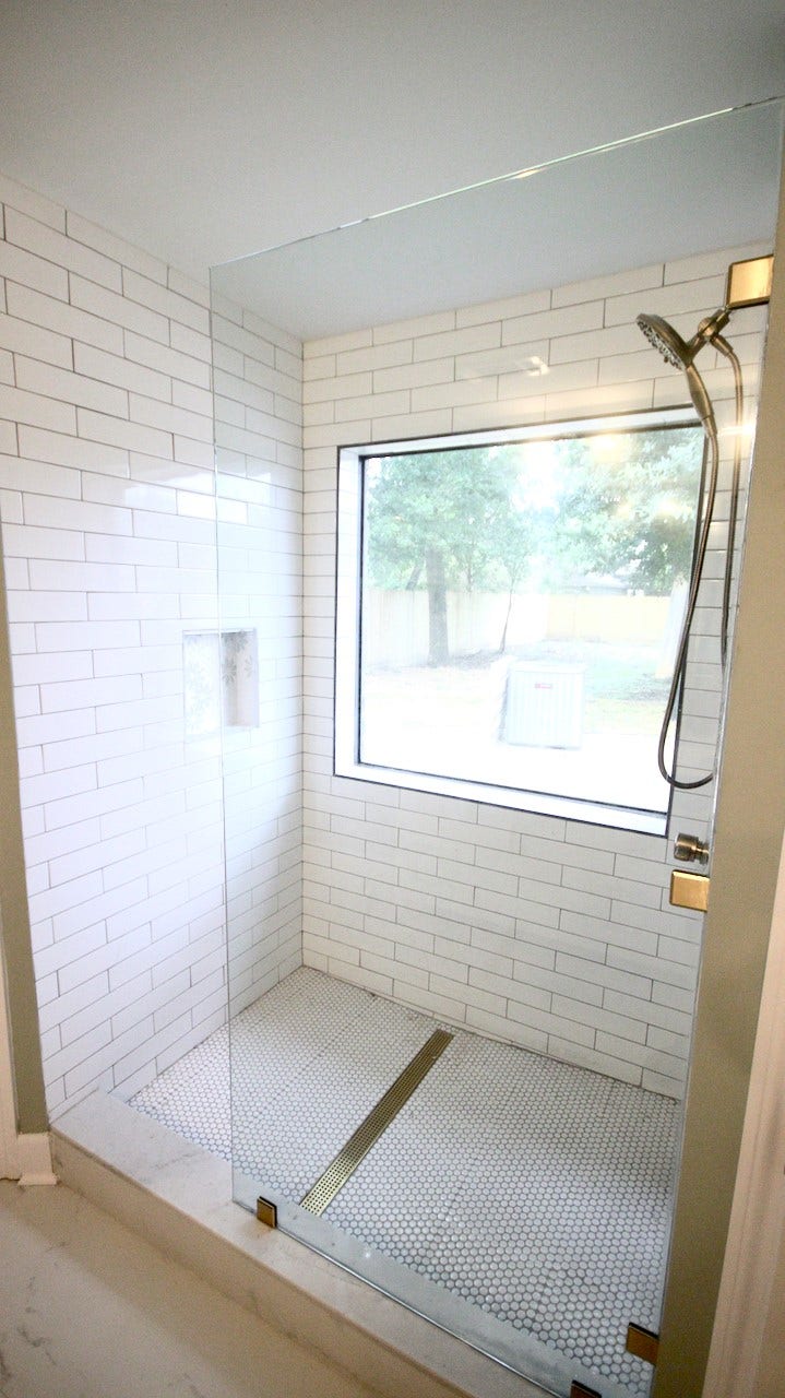 7827 Zilonis Court, Jersey Village, TX 77040 Spacious master walk-in shower with a large window offering natural light.