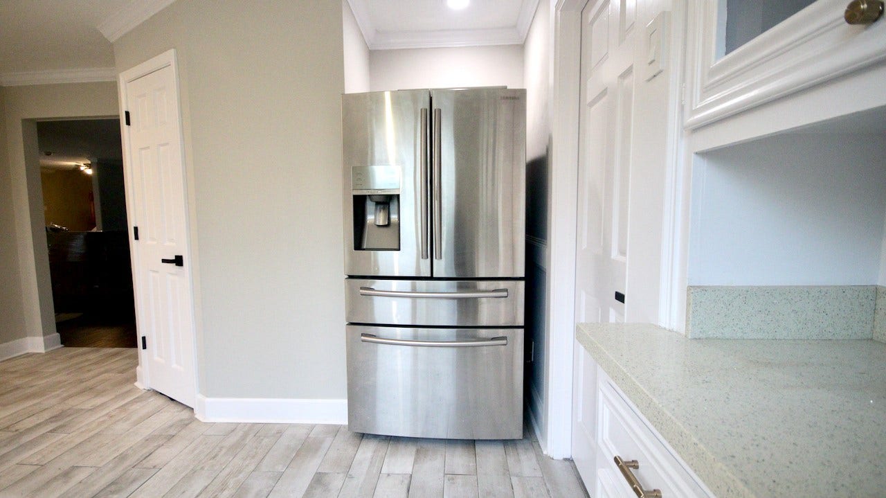 7827 Zilonis Court, Jersey Village, TX 77040 Stainless steel Samsung refrigerator featuring a convenient meat drawer and water dispenser.