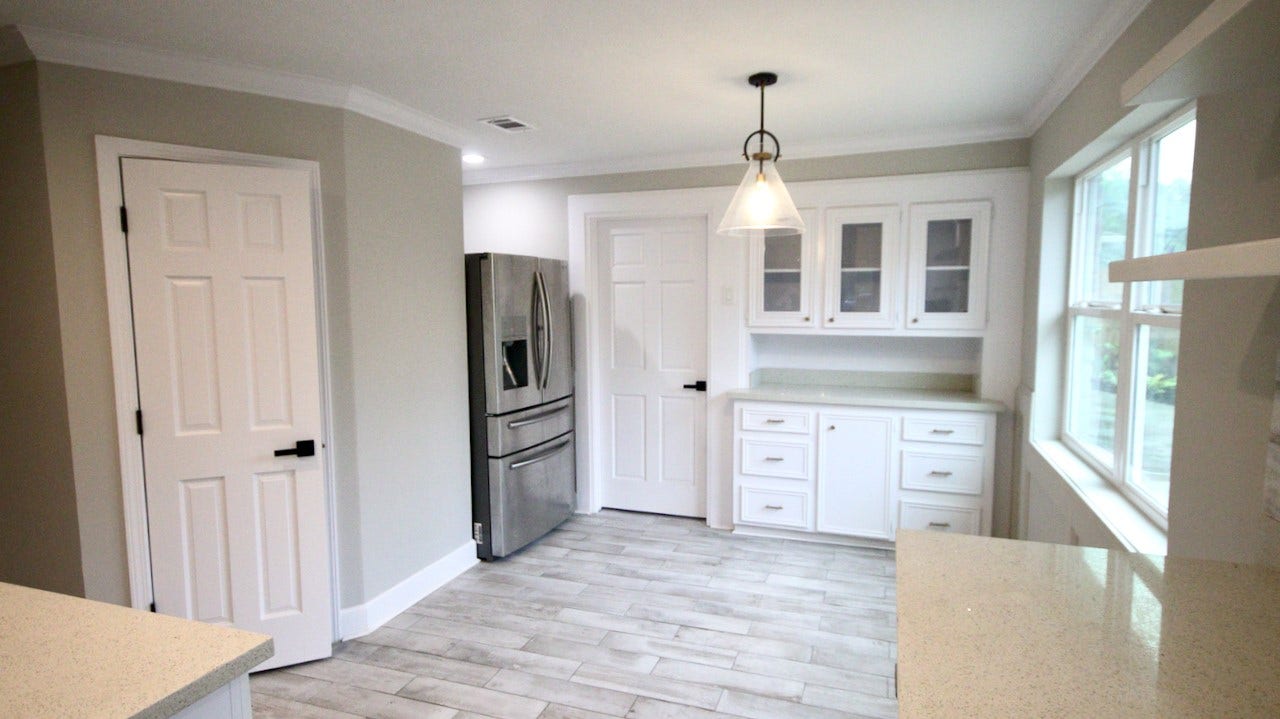 7827 Zilonis Court, Jersey Village, TX 77040 Elegant light fixture enhances the cozy breakfast area.