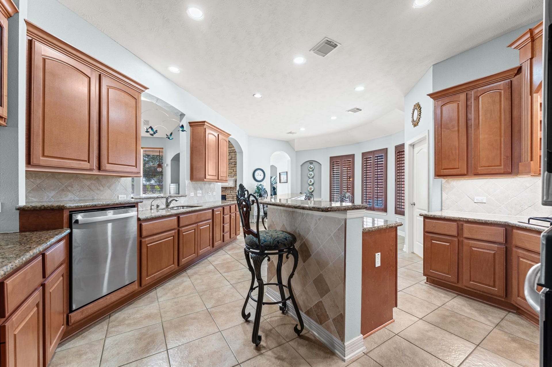 17202 Ledgefield, Cypress, TX 77433 This view is from entry of the kitchen. The breakfast room is on the other side where you see the blinds.