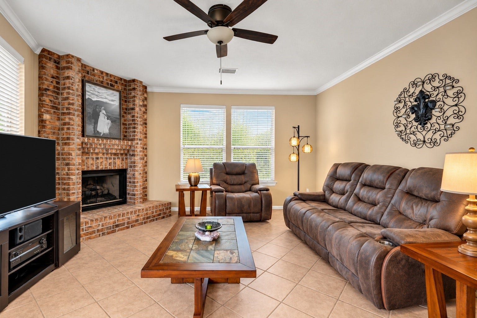 7914 Hickory Mill Court, Houston, TX 77095 The inviting living area offers a comfortable place to gather with family and friends or simply unwind at the end of the day. A cozy fireplace creates a warm focal point, while tile flooring adds both style and easy maintenance, making this space ideal for everyday living and entertaining.