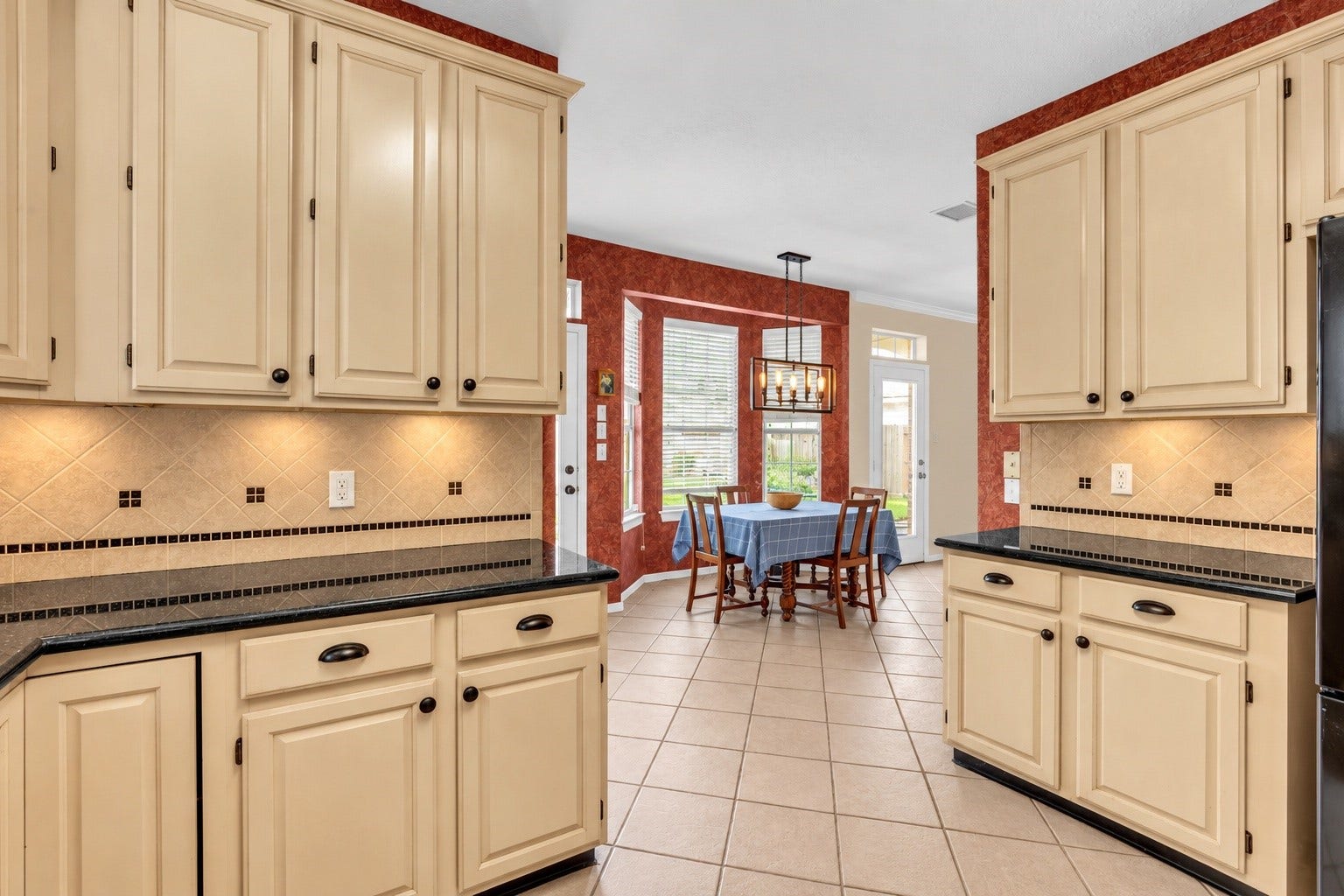 7914 Hickory Mill Court, Houston, TX 77095 The kitchen offers a welcoming space for preparing everyday meals while staying connected to the adjoining breakfast nook. Enjoy views of the sunlit breakfast area and backyard beyond, creating an inviting setting where cooking, conversation, and the comforts of home come together effortlessly.