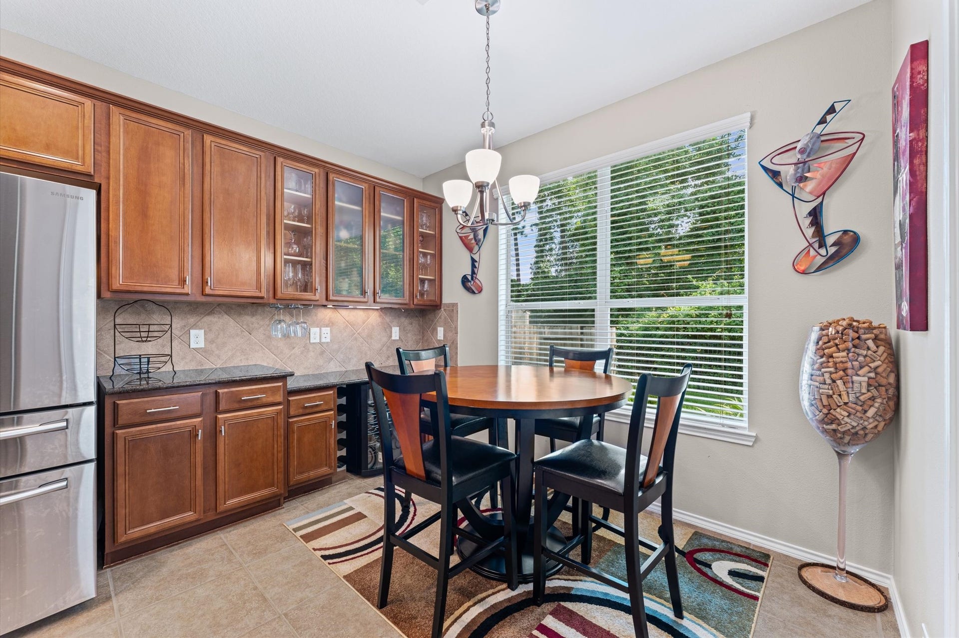 13423 Hartland Lake Lane, Houston, TX 77044 Bright and inviting kitchen nook features a modern and a cozy dining area with large windows offering serene views.