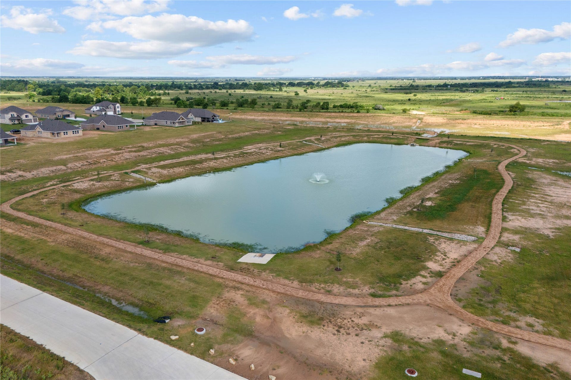 402 Cane Crossing Lake Drive, Sealy, TX 77474 Take a relaxing walk around the community pond.