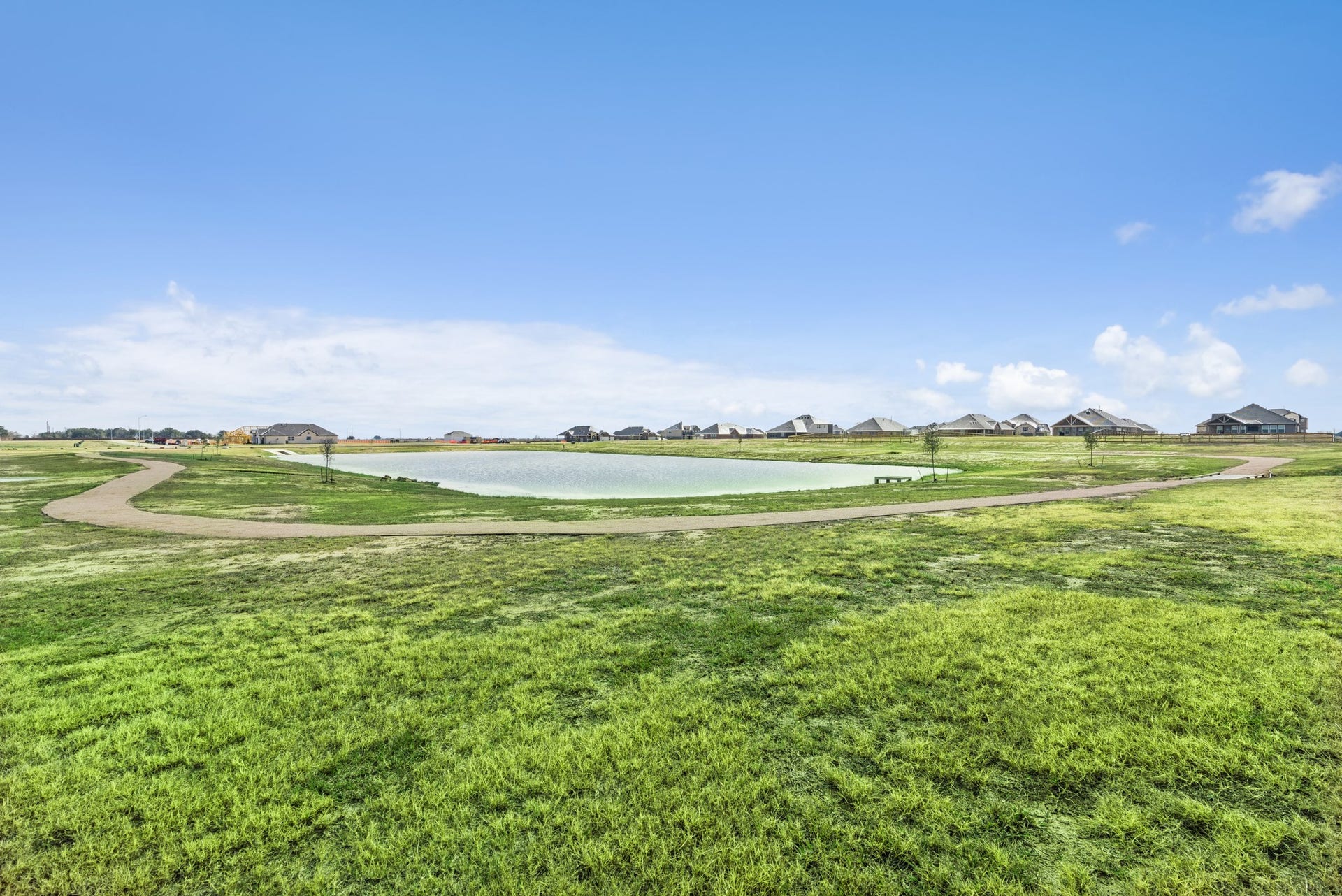 402 Cane Crossing Lake Drive, Sealy, TX 77474 Relax around the community pond!