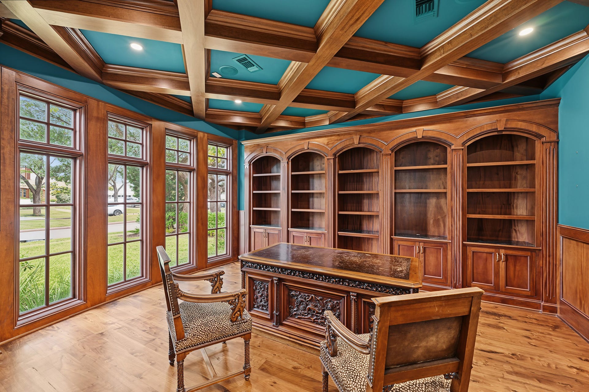 3223 Albans Road, West University Place, TX 77005 The second study features floor-to-ceiling windows that fill the space with natural light, a detaile coffered ceiling, and custom built-in cabinetry and shelving.