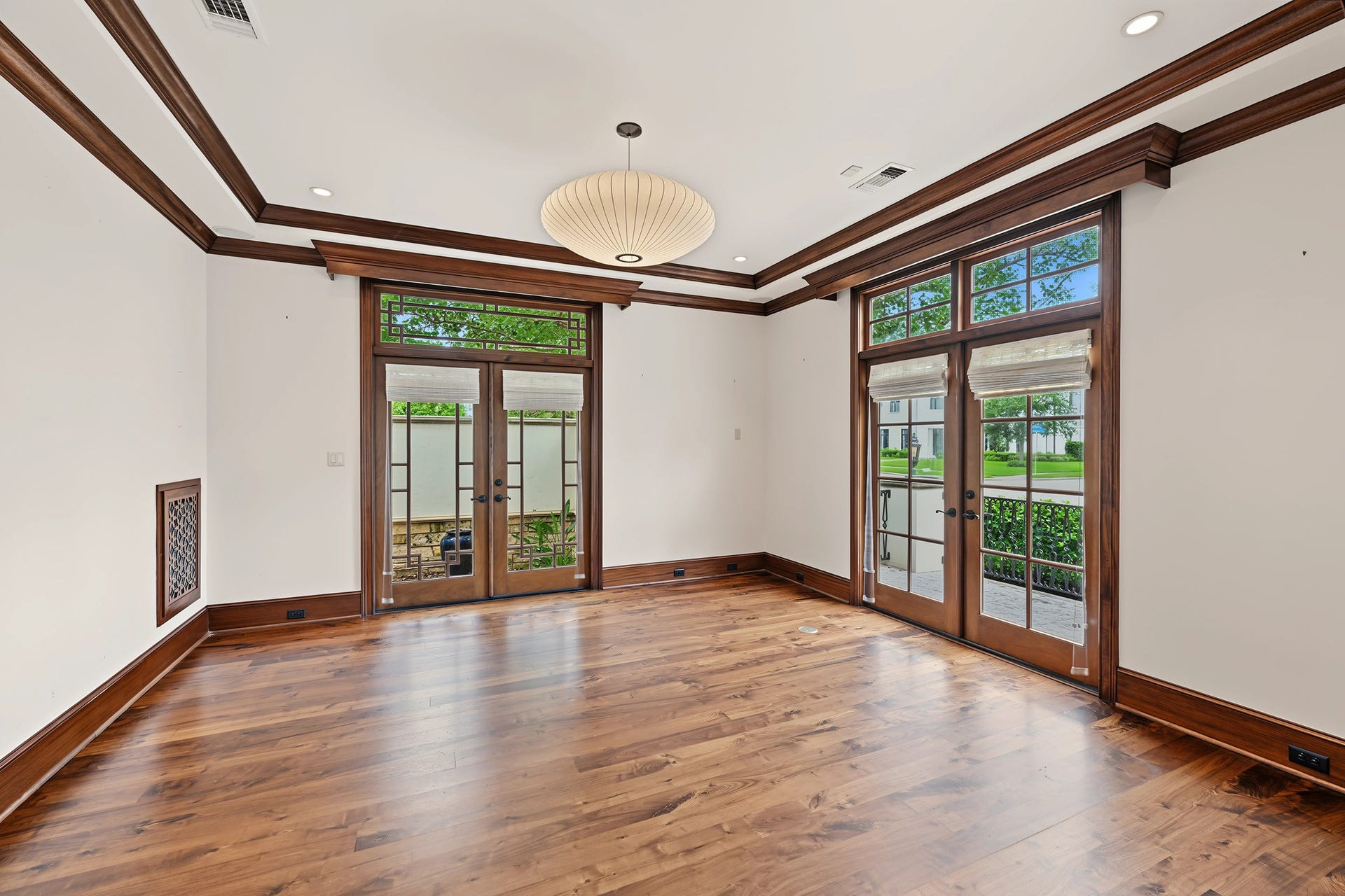 3223 Albans Road, West University Place, TX 77005 Alternate view of the study highlights two sets of French doors, a modern light fixture and beautiful floors.