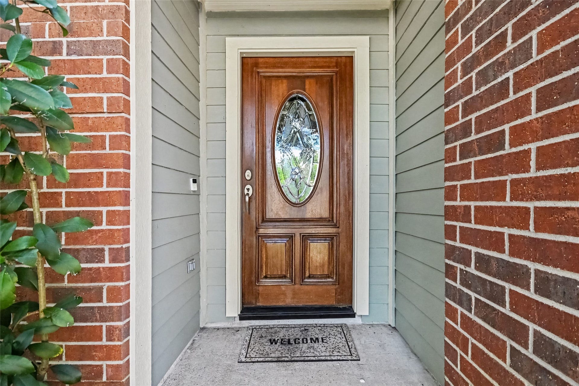 213 Rippling Creek Lane, Alvin, TX 77511 Beautiful leaded glass door, be sure to look up at the wood finished porch ceiling