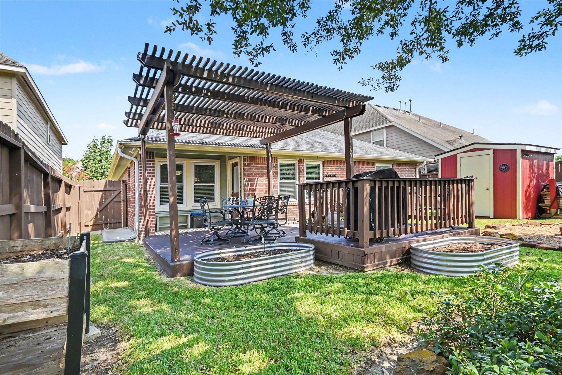 213 Rippling Creek Lane, Alvin, TX 77511 Notice the storage shed so you can keep the backyard tidy with a place for your lawn and gardening implements