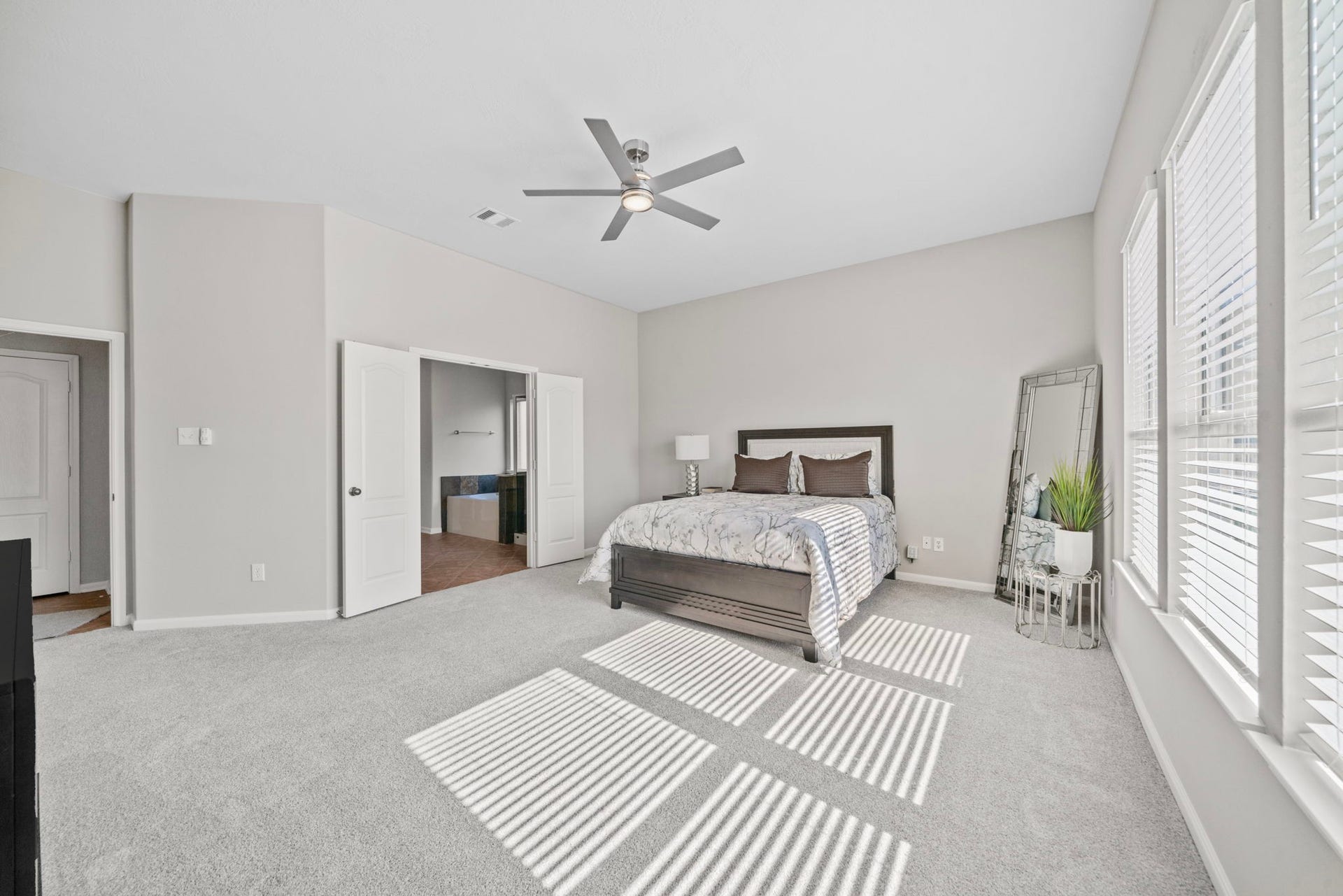8523 Sweetstone Field Court, Cypress, TX 77433 Primary suite filled with natural light and comfort.