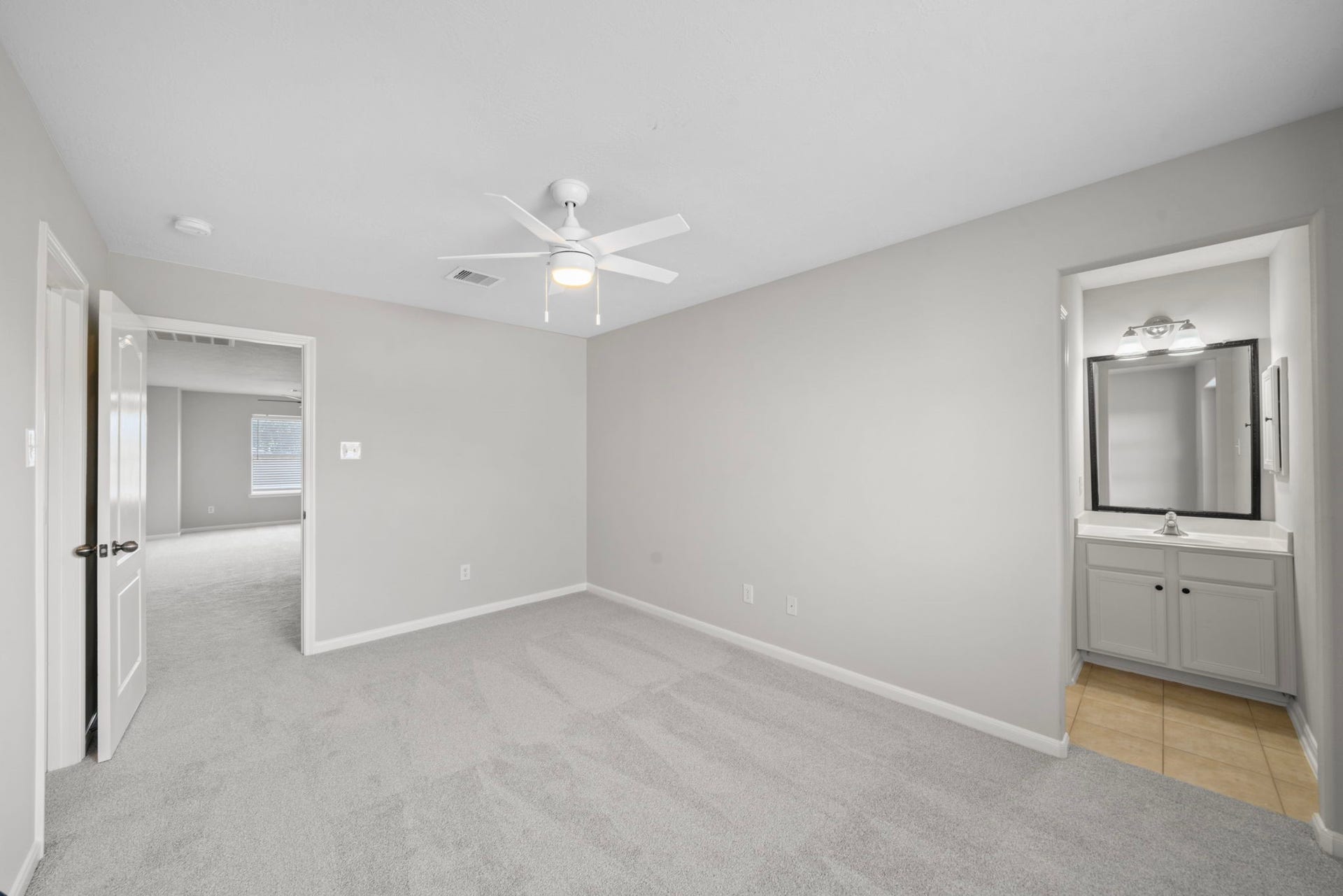 8523 Sweetstone Field Court, Cypress, TX 77433 Large upstairs bedroom with generous space and storage.