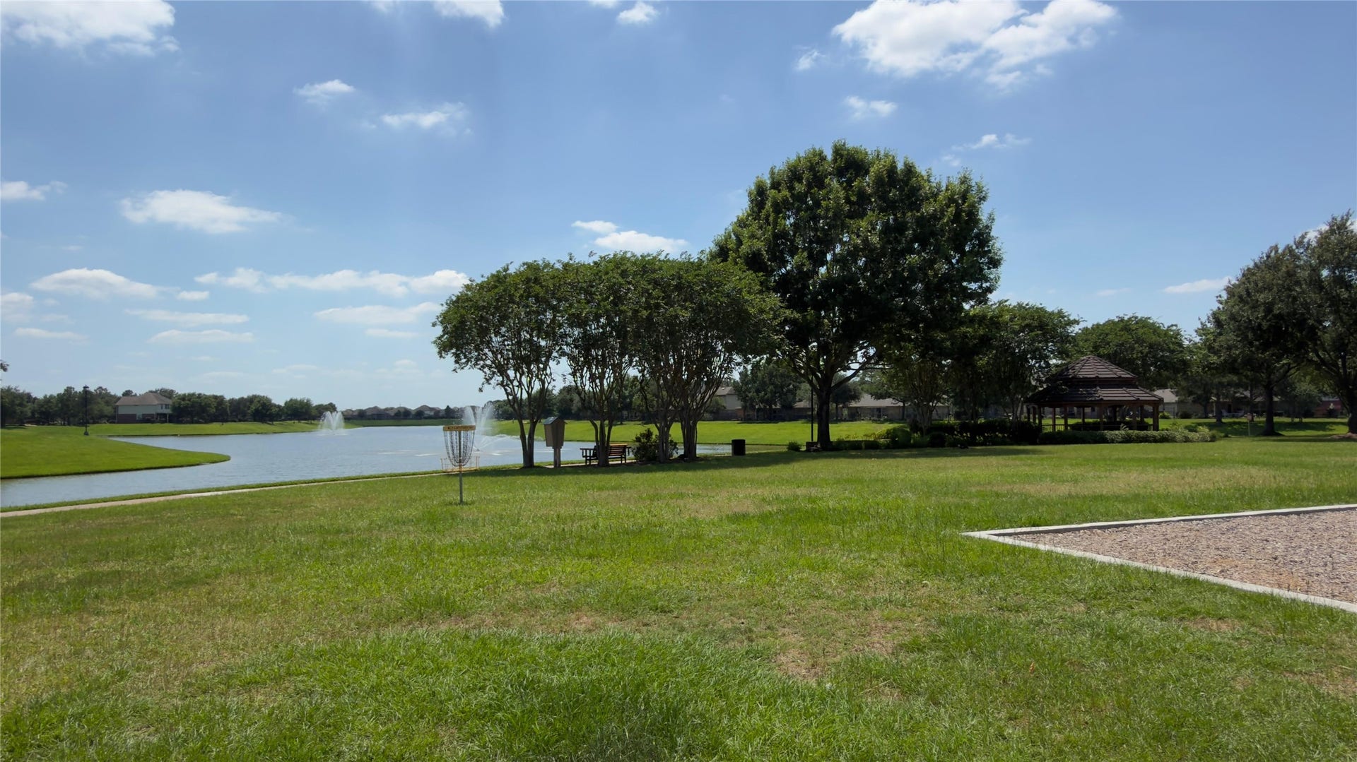 8523 Sweetstone Field Court, Cypress, TX 77433 Scenic walking paths and green spaces around the lake.