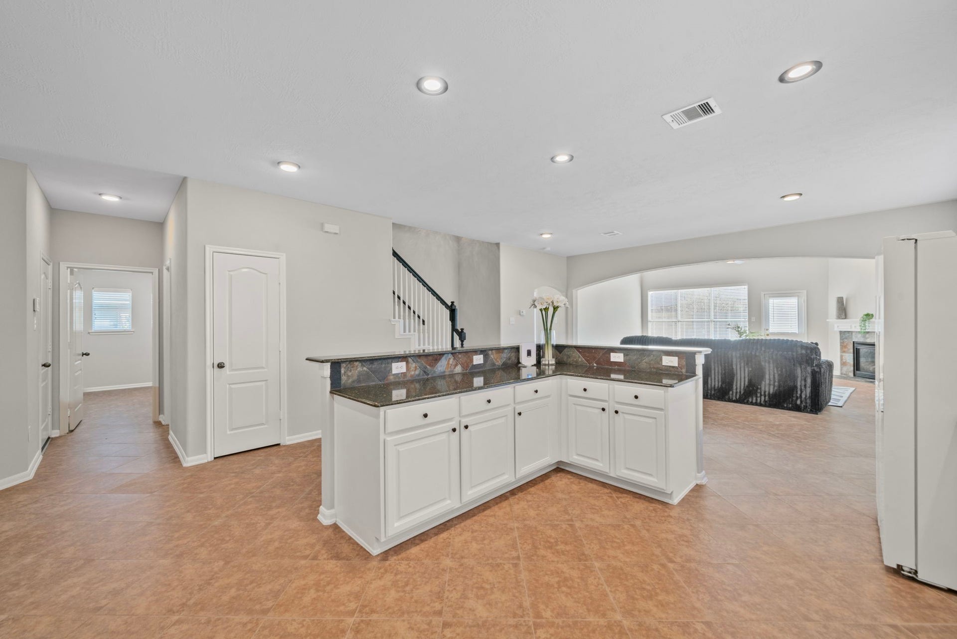 8523 Sweetstone Field Court, Cypress, TX 77433 Open layout connecting kitchen and living spaces seamlessly.