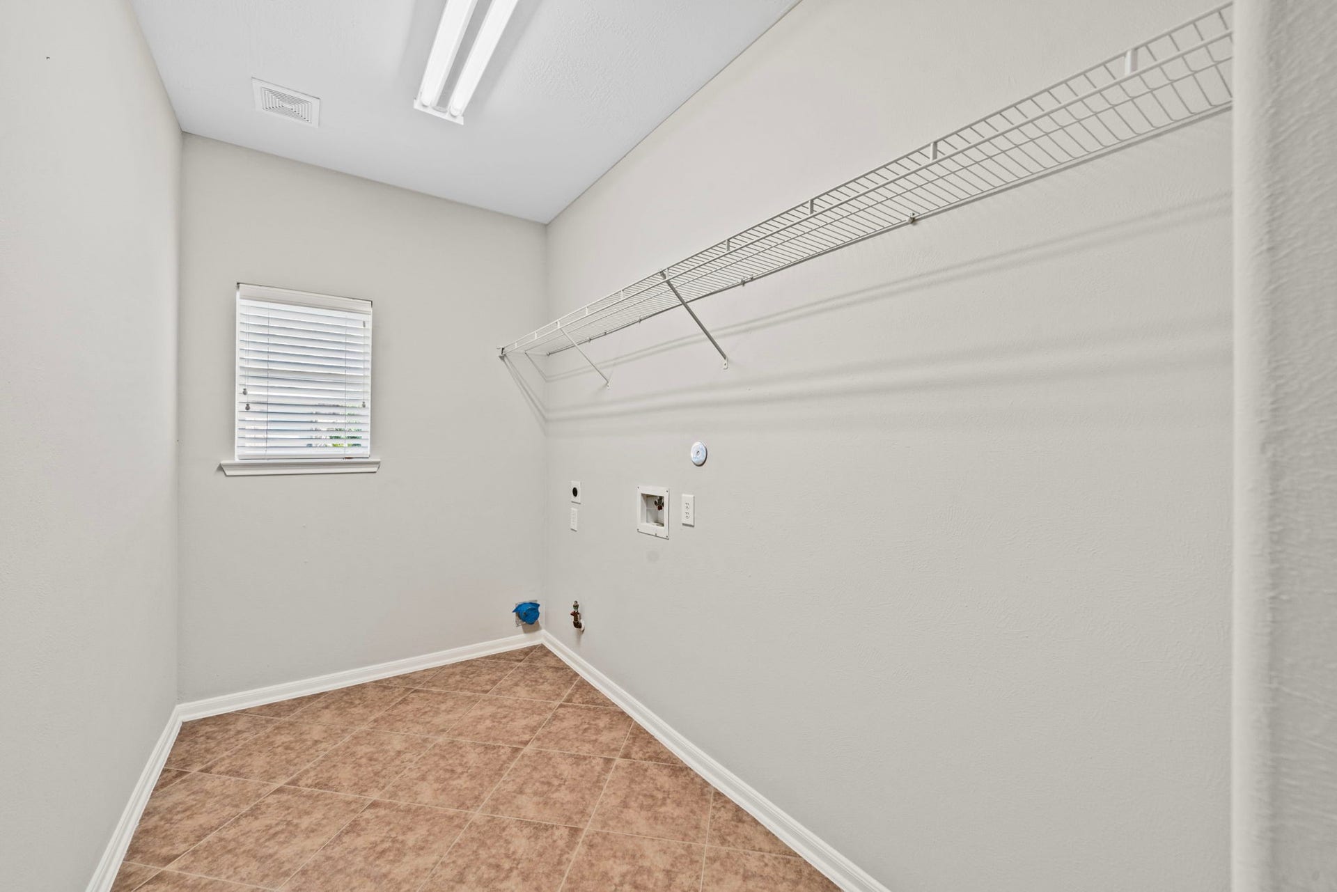 8523 Sweetstone Field Court, Cypress, TX 77433 Spacious laundry room with extra storage area.